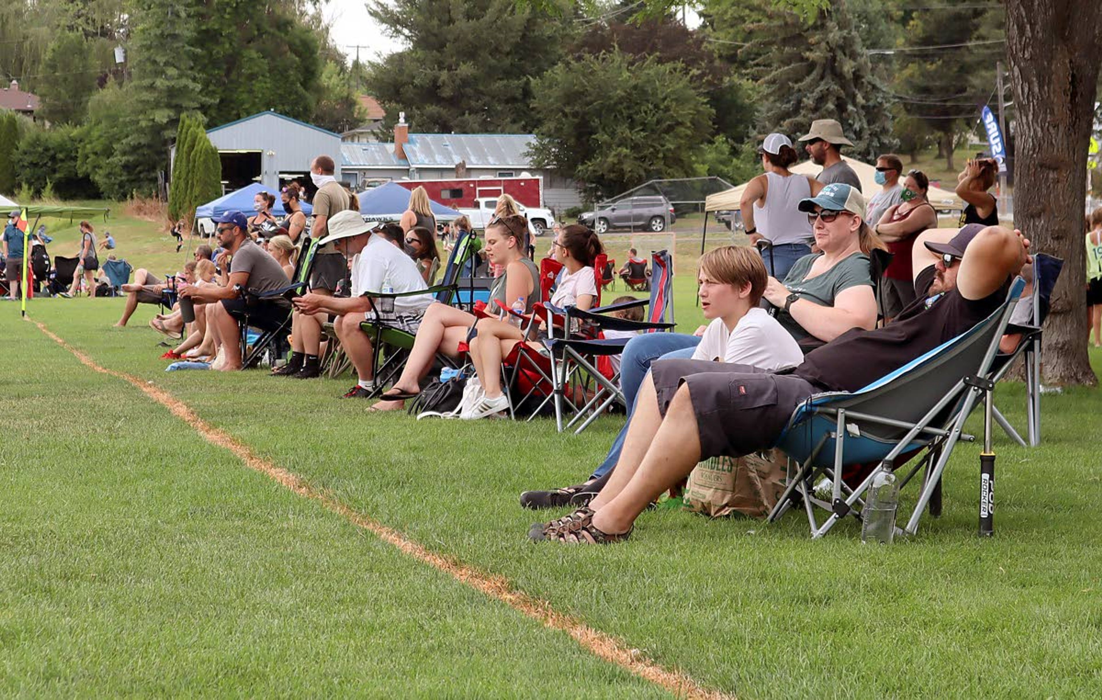 Fans watch a game at the Eastern Washington Surf Soccer Club Harvest Cup soccer tournament at Oylear Field in Moscow. The tournament was shut down on Sunday for violating the Moscow Mayor’s order to wear masks in public places when social distancing isn’t possible.