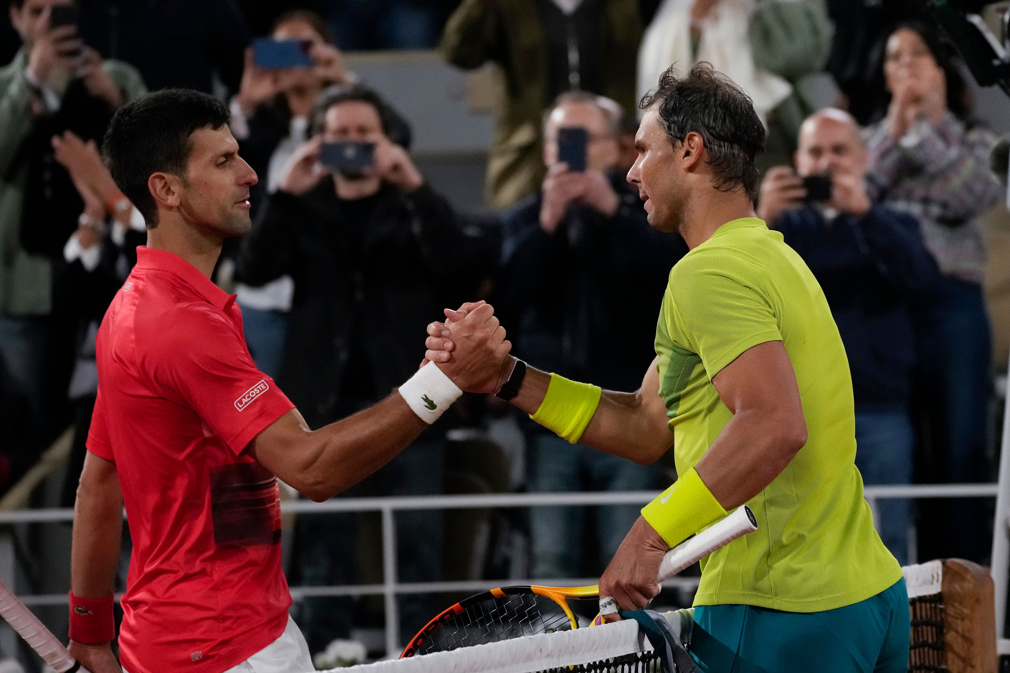 Associated PressSerbia’s Novak Djokovic, left, congratulates Spain’s Rafael Nadal after Nadal won the quarterfinal match in four sets Tuesday night at the French Open tennis tournament in Roland Garros stadium in Paris.