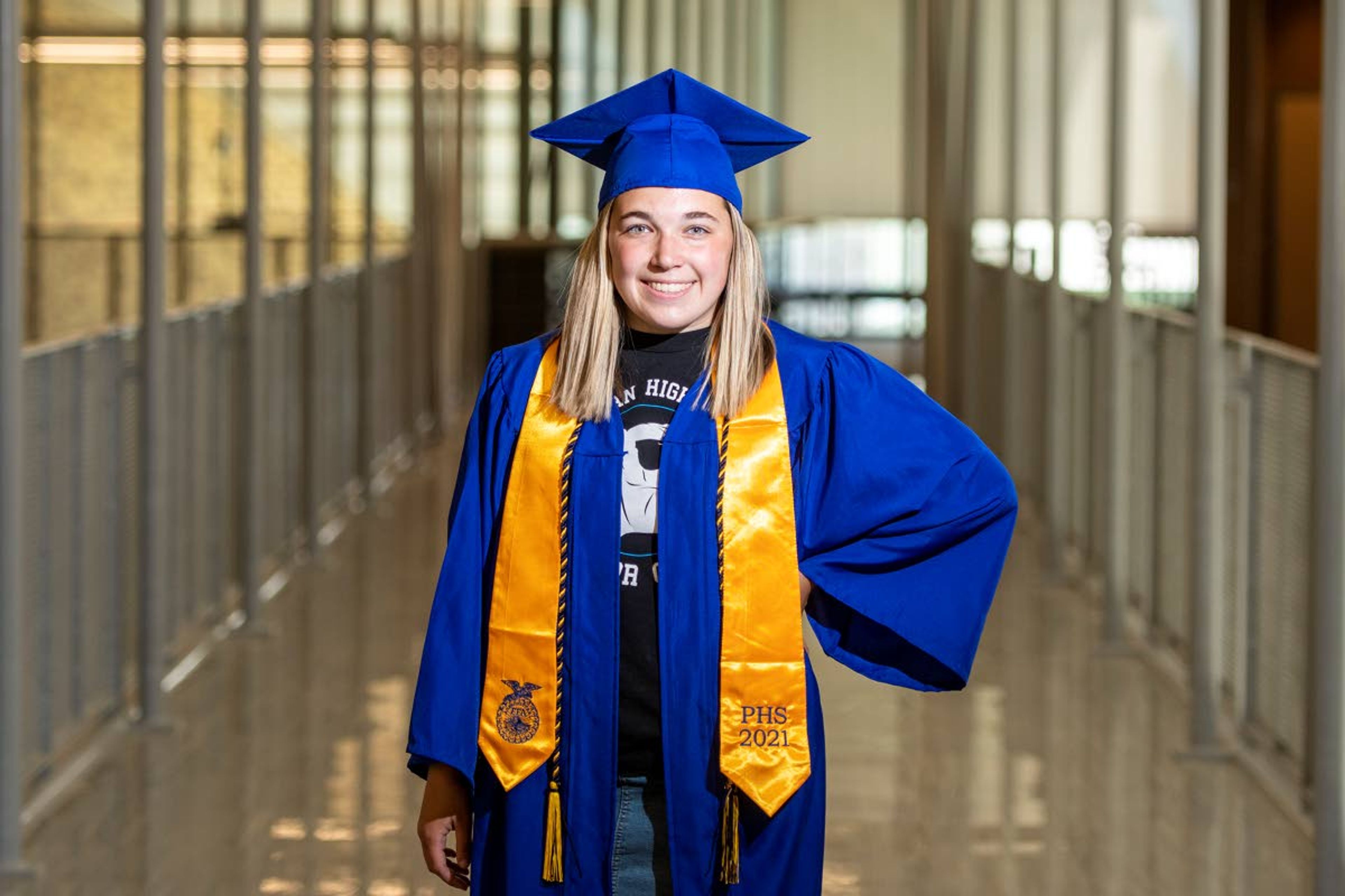 Zach Wilkinson/Daily NewsIn her graduation regalia, senior Hannah Talbot poses for a picture on the catwalk at Pullman High School. Talbot is a honor graduate with plans of attending Washington State University to pursue a degree in elementary education. The Pullman graduation ceremony takes place at 5 tonight at Pullman High School’s Hobbs Field.