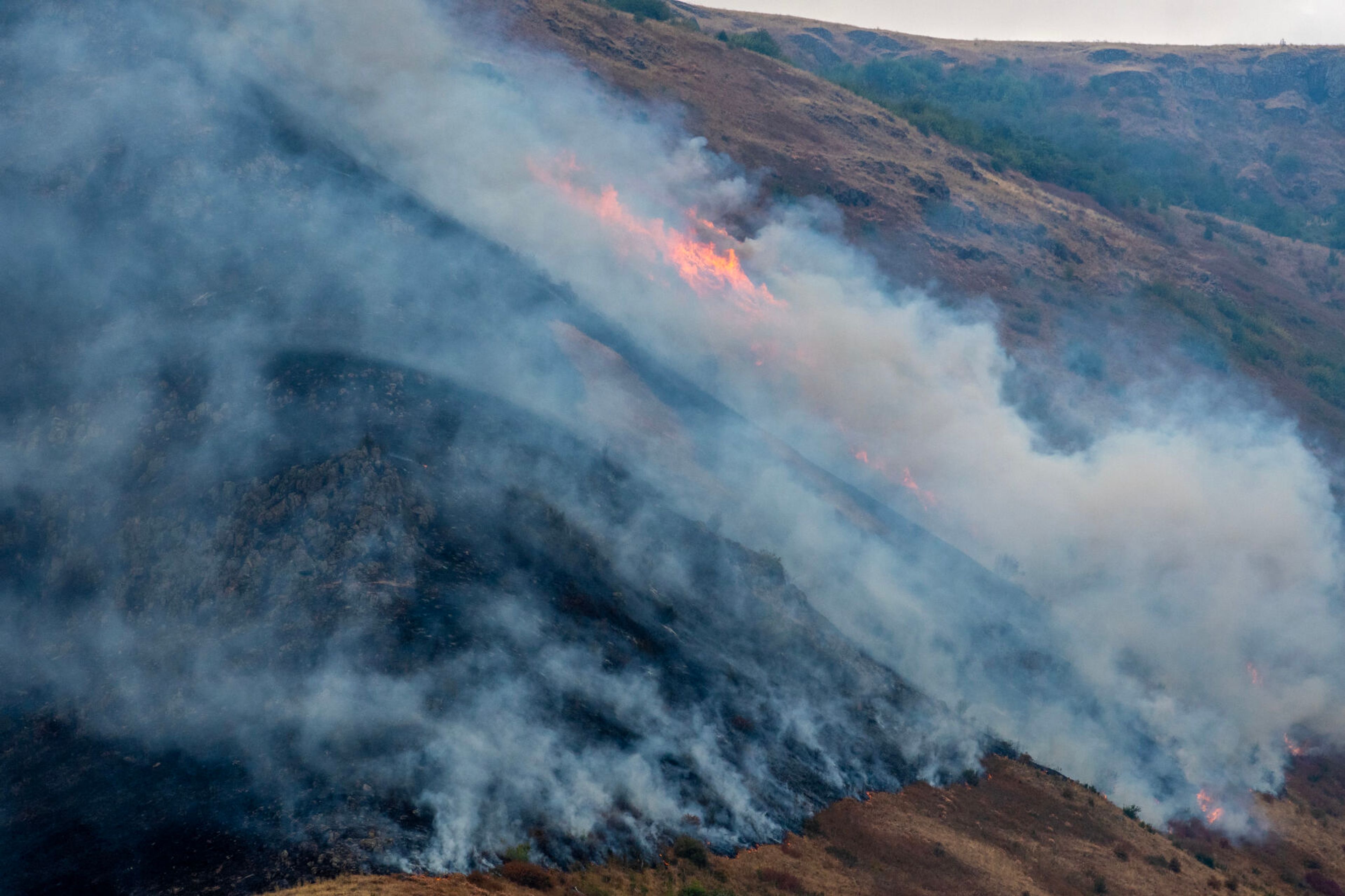 The Lower Granite Fire burns Tuesday off the Snake River.