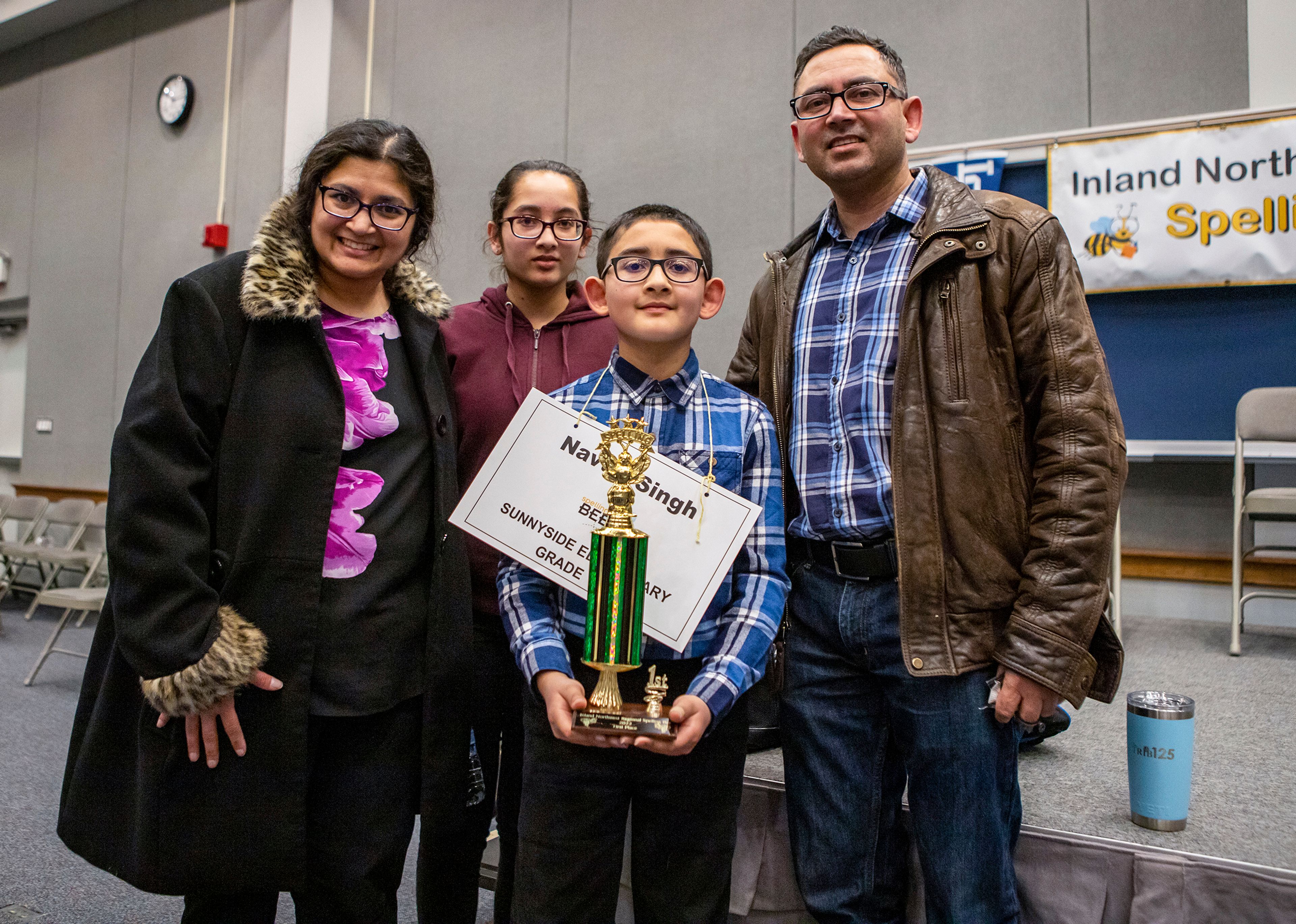 Austin Johnson/Daily News Singh poses with his family after winning the Inland Northwest Regional Spelling Bee.