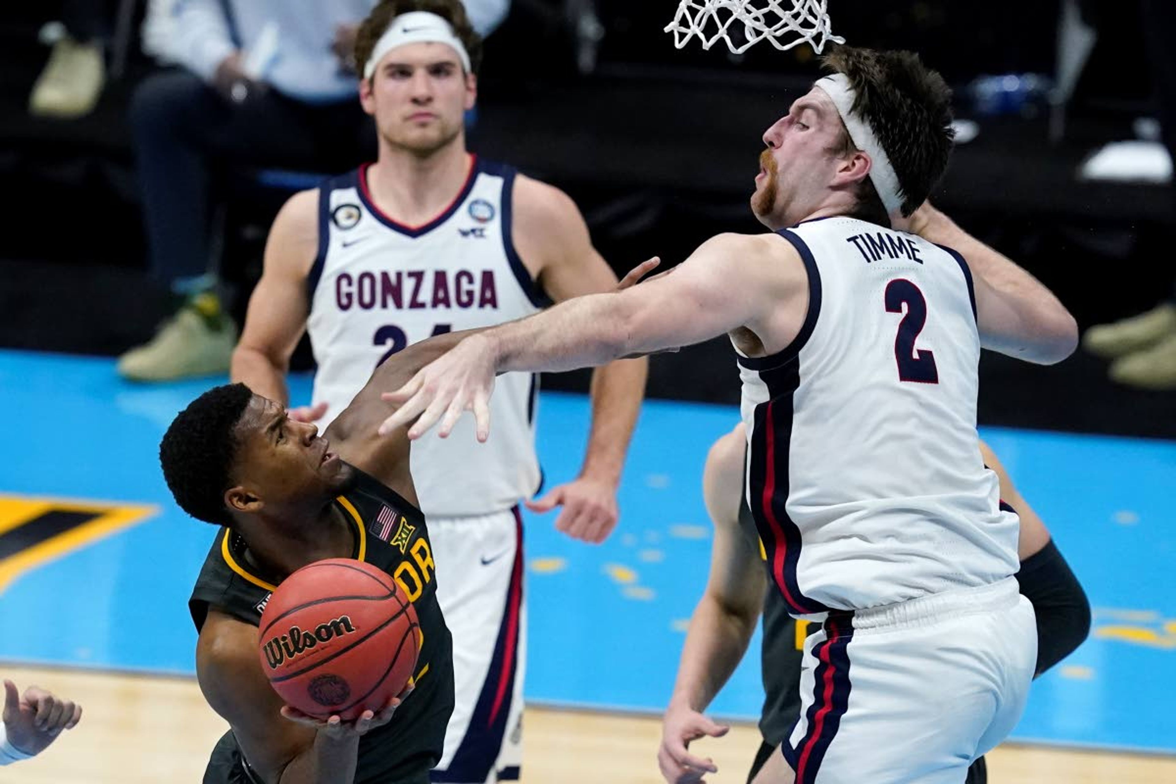 Baylor guard Jared Butler shoots over Gonzaga forward Drew Timme (2) during the second half of the championship game in the men's Final Four NCAA college basketball tournament, Monday, April 5, 2021, at Lucas Oil Stadium in Indianapolis. (AP Photo/Darron Cummings)