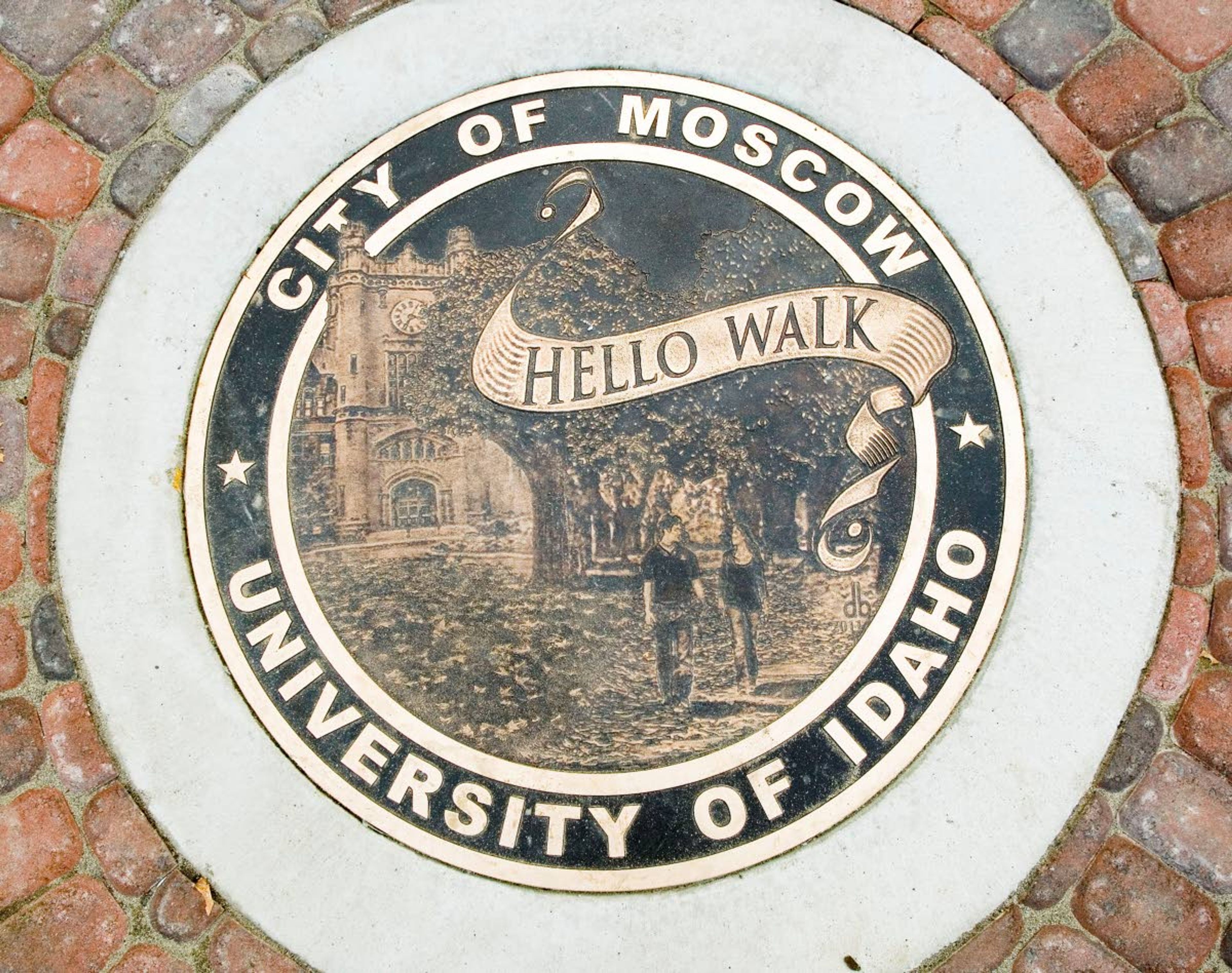 A plaque sits in the sidewalk below new steps leading to the Hello Walk at the University of Idaho in Moscow.