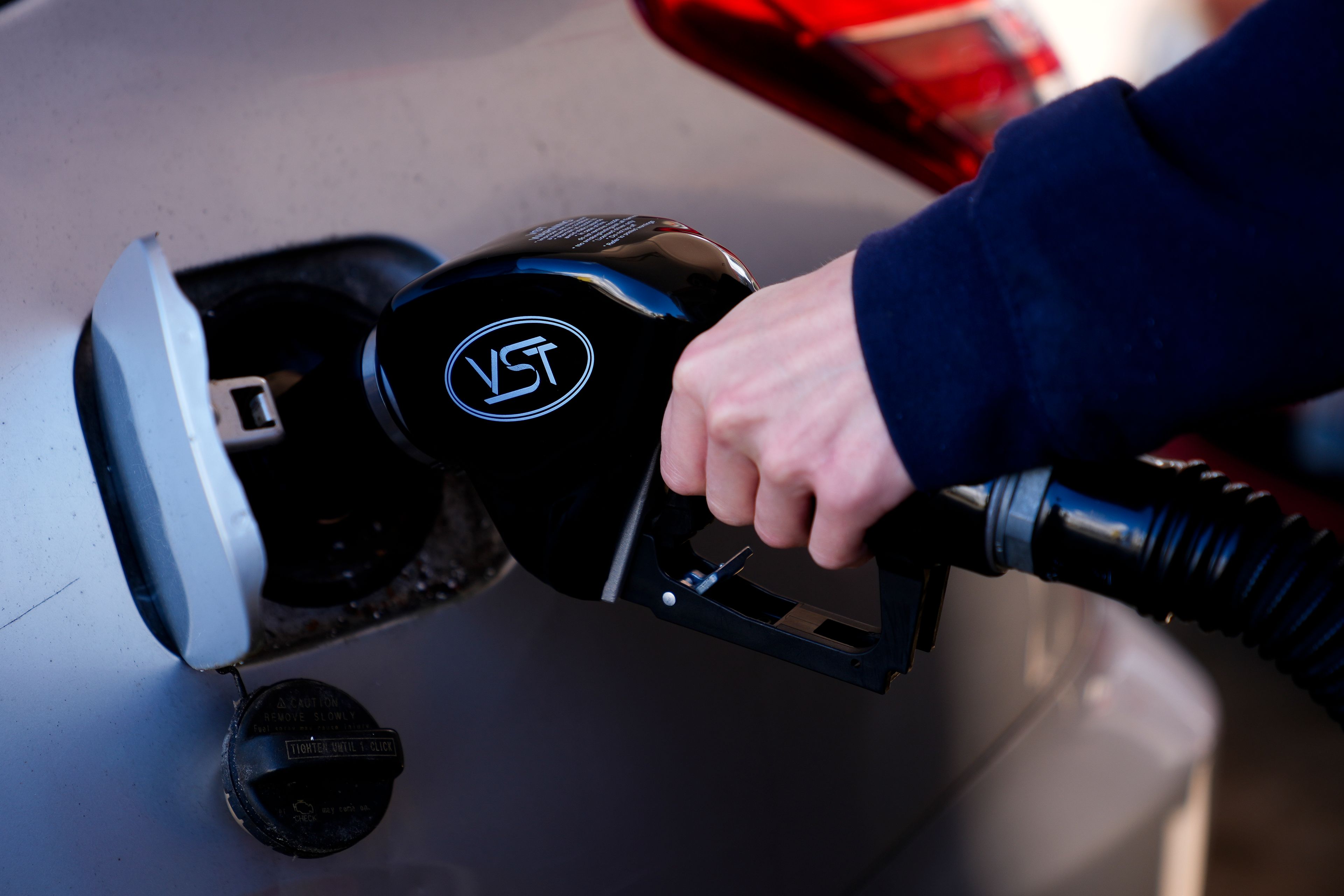 A driver fills up at a gasoline pump at a Shell gas station, Wednesday, Oct. 9, 2024, in Seattle. (AP Photo/Lindsey Wasson)