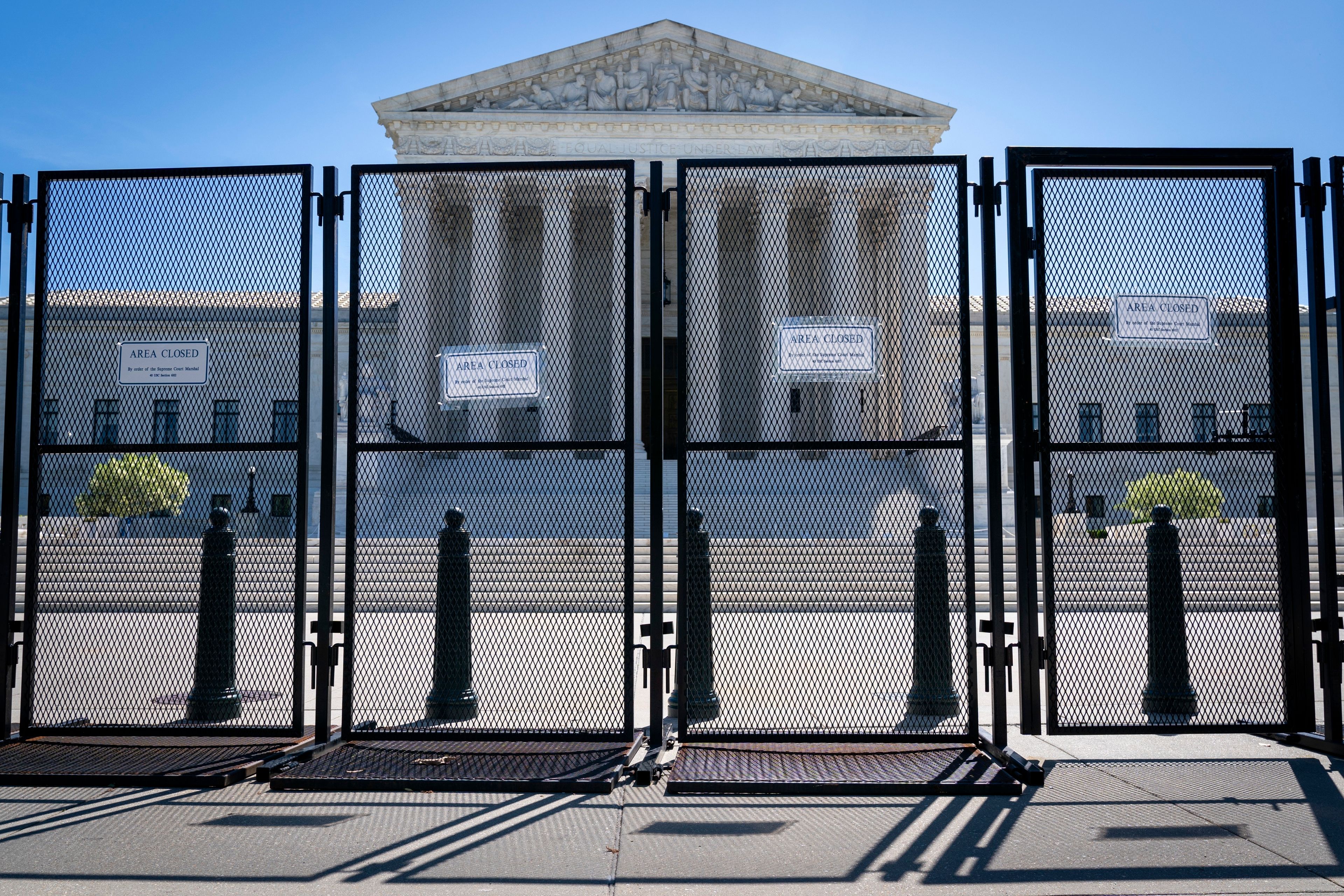 Anti-scaling fencing blocks off the stairs to the Supreme Court, Tuesday, May 10, 2022, in Washington. Abortion legislation facing a Senate test vote would enshrine into federal law the landmark 1973 Roe v. Wade decision that legalized abortion nationwide. Senate Democrats are moving quickly to try to codify the 50-year-old ruling after a leaked draft of a U.S. Supreme Court opinion suggested the court is poised to overturn the case.