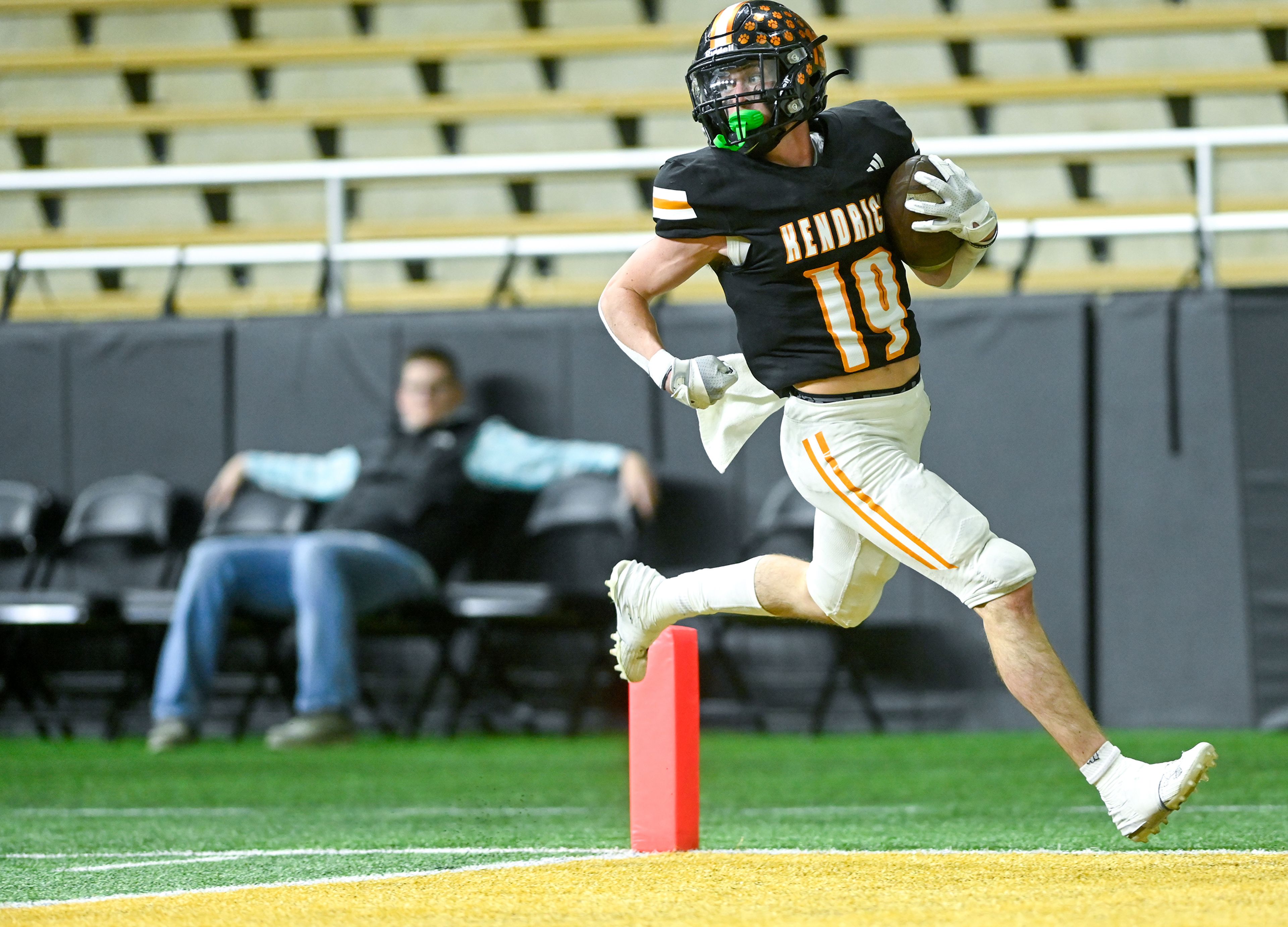 Kendrick’s Sawyer Hewett carries the ball into the end zone for a touchdown against Butte County Friday during the Idaho 2A football state championship game at the P1FCU Kibbie Dome in Moscow.