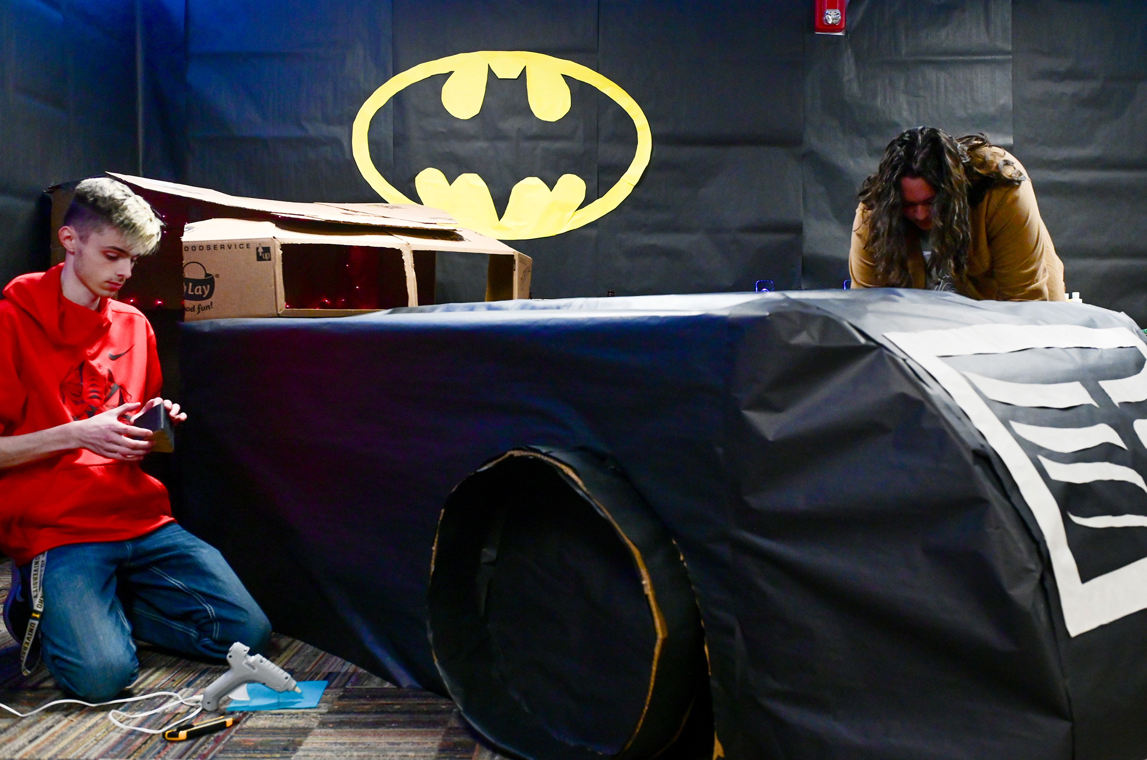 Theophilus Tower  residents Evan Coulthurst, left, and Simon Olivas 
work Wednesday on creating  a Batmobile in the lounge of the second floor for the upcoming Theophilus Tower Trick-or-Treat at the dorm 
on the University of Idaho campus. The event takes place from 2-4 p.m. Saturday with candy from residents on each floor, which are decorated in different fantasy themes, and games on even-numbered levels.
