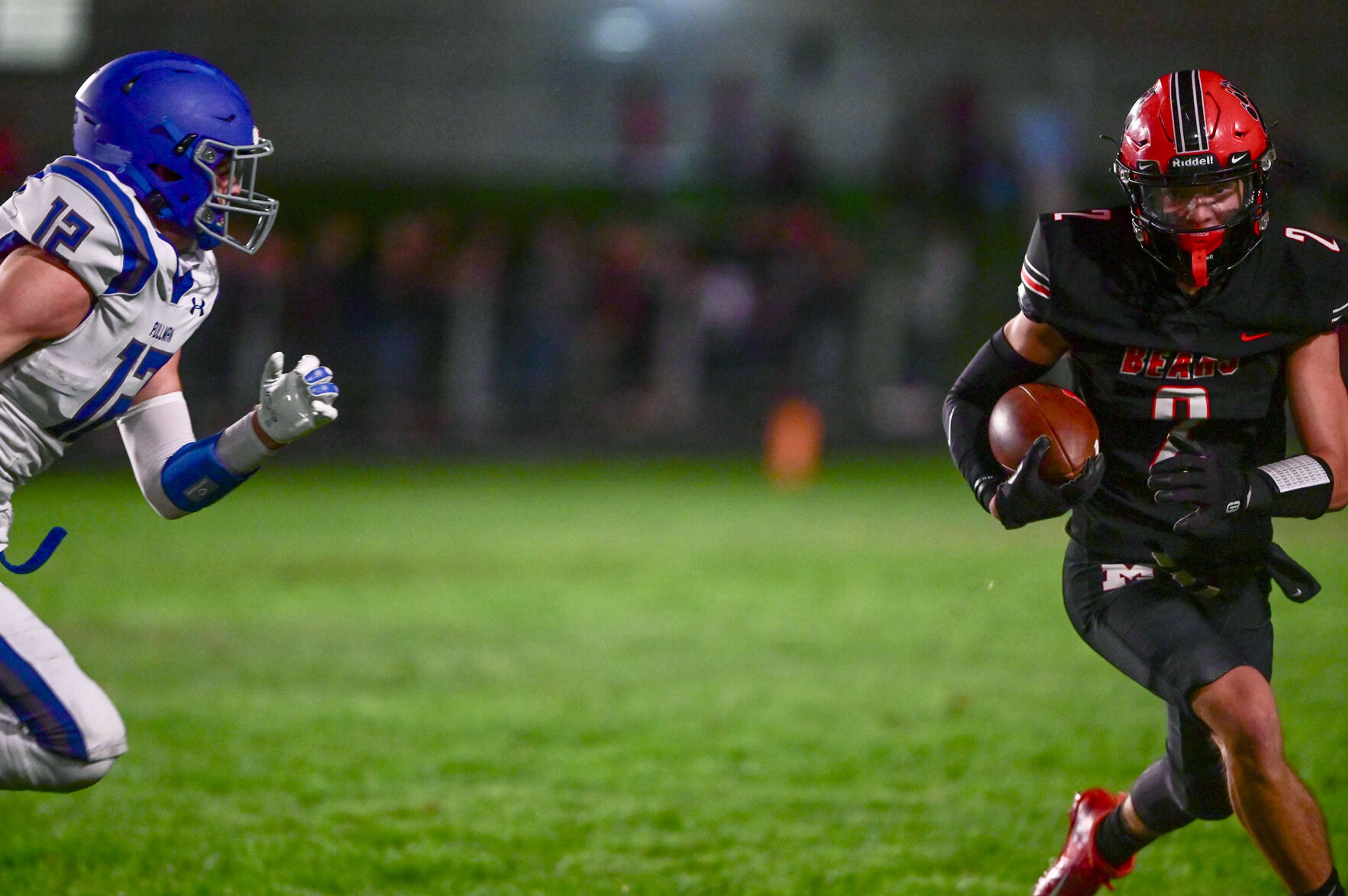 Pullman linebacker Hunter Recknagle chases down Moscow wide receiver Butch Kiblen Friday in Moscow.