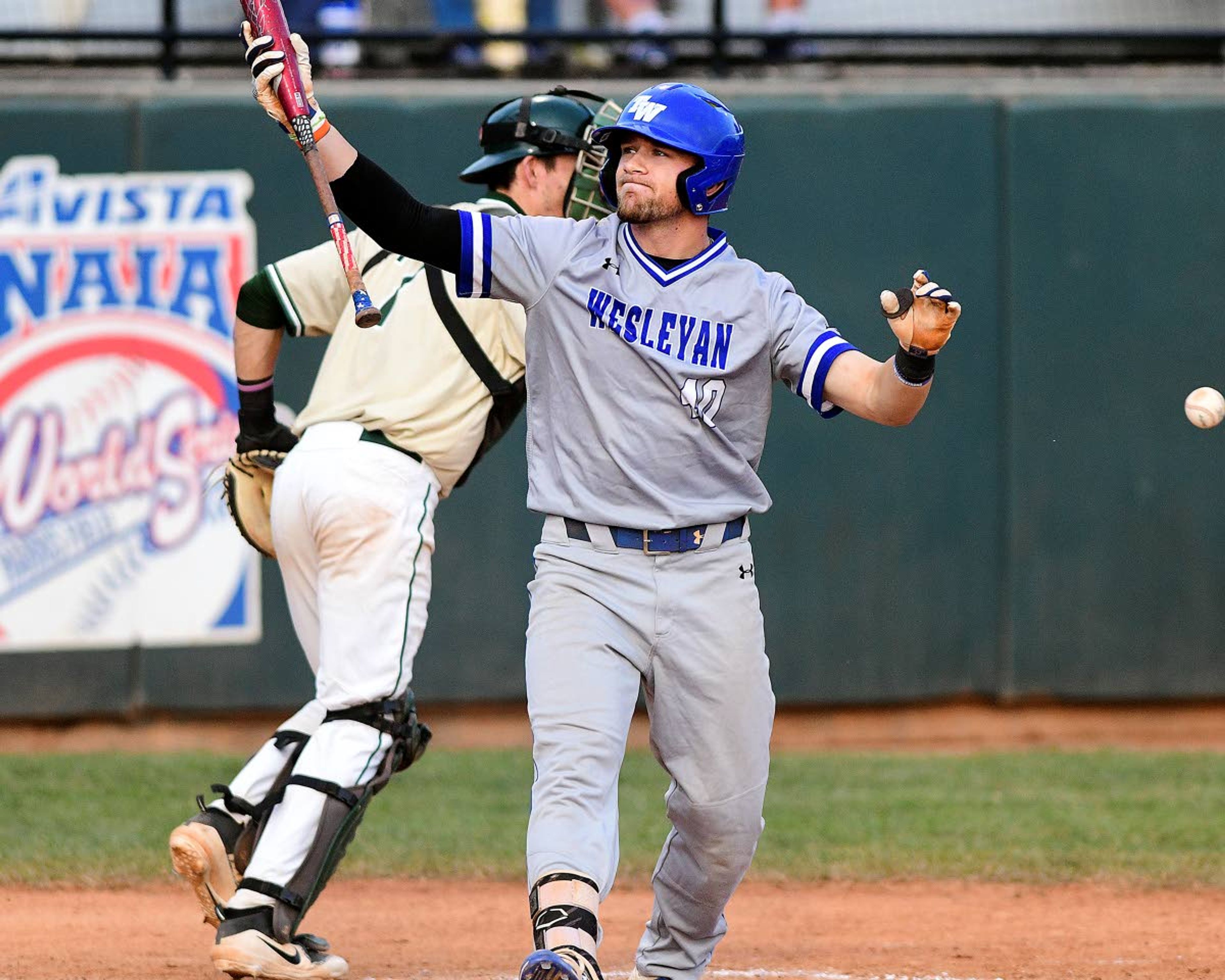 Tennessee Wesleyan's Dan Fry (40) walks back to the dugout frustrated after striking out to end the top of the third inning of game 17 of the NAIA World Series on Wednesday at Harris Field in Lewiston.