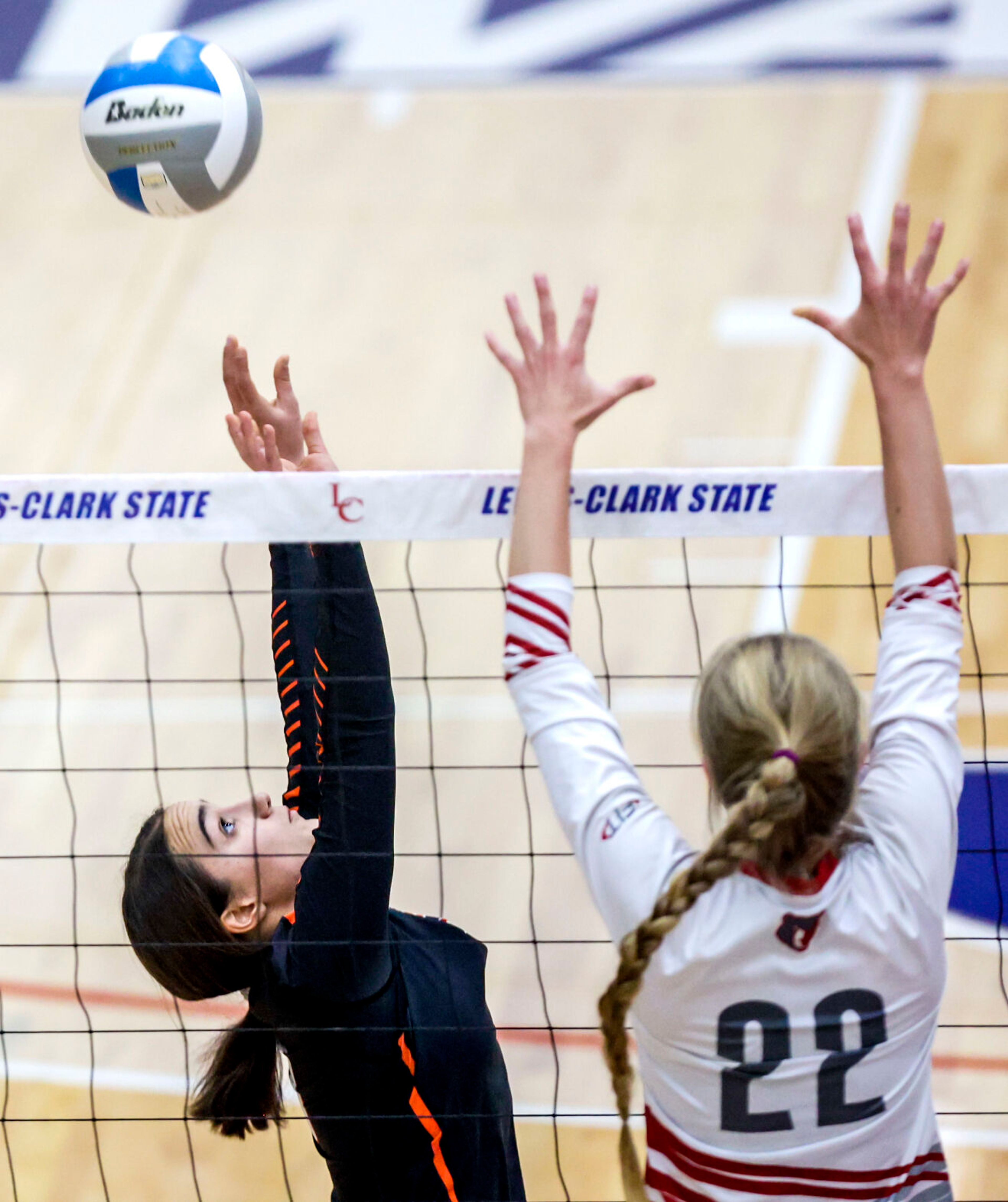 Troy setter Isabelle Raasch sets the ball at the Lewis-Clark State College Athletic Center on Saturday. Troy defeated Grace in three sets to become the 1A DI state champions.