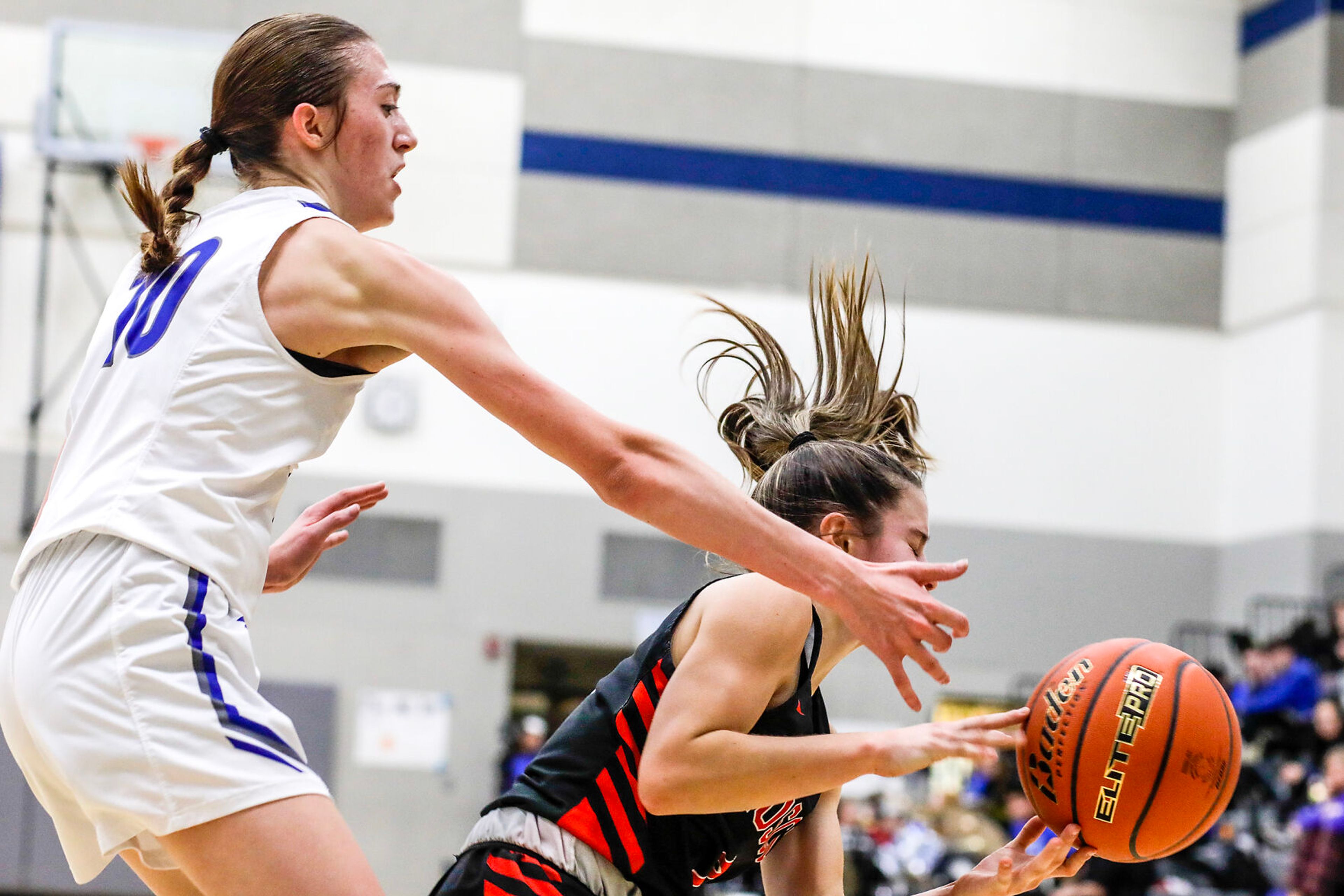 Moscow guard McKenna Knott, right, tries to keep possession of the ball as Pullman guard Lacie Sines defends during Saturday's nonleague girls basketball game.