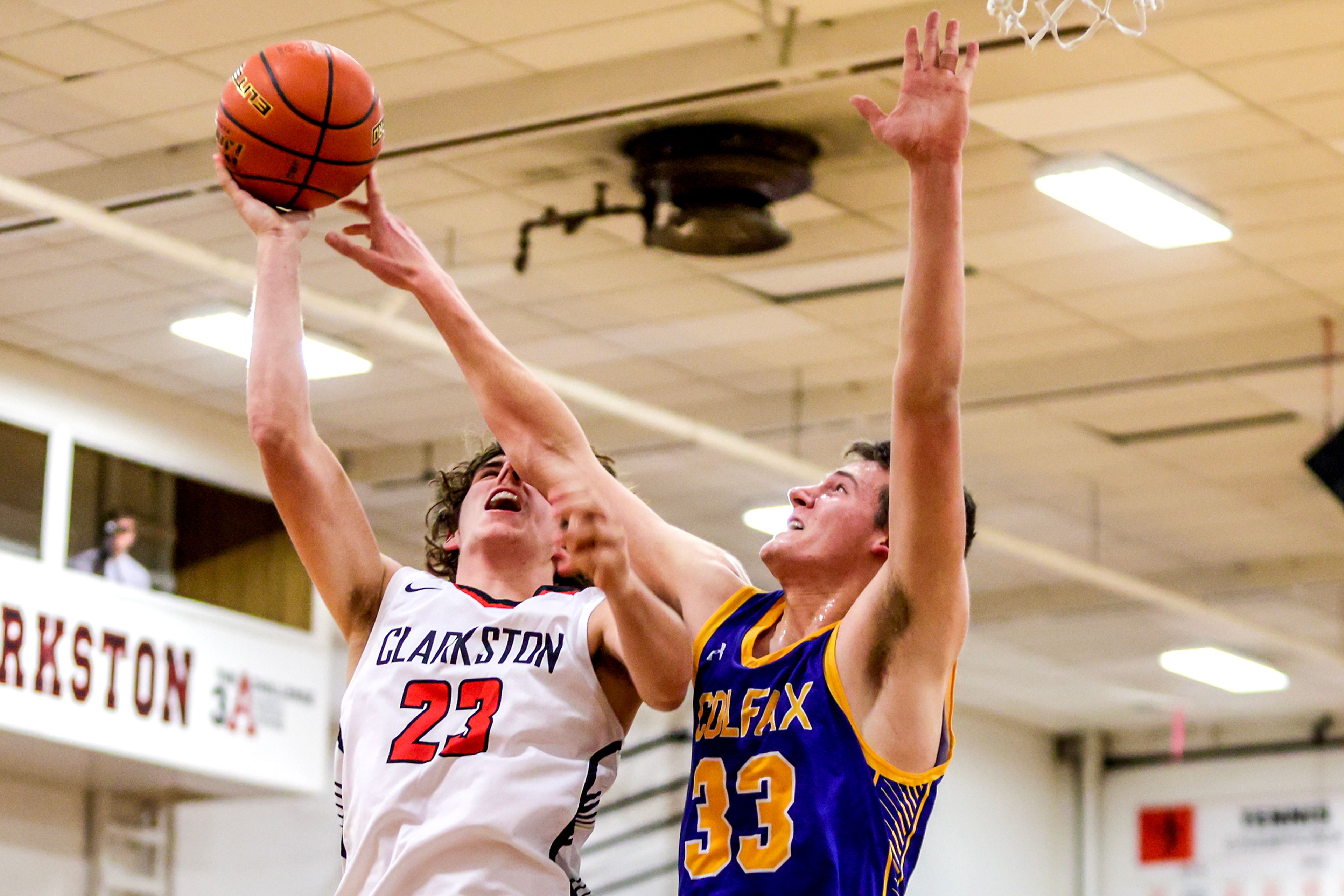 Colfax James Wigen manages to block Clarkston forward Josh Hoffman’s shot in a quarter of a nonleague game Thursday at Clarkston.