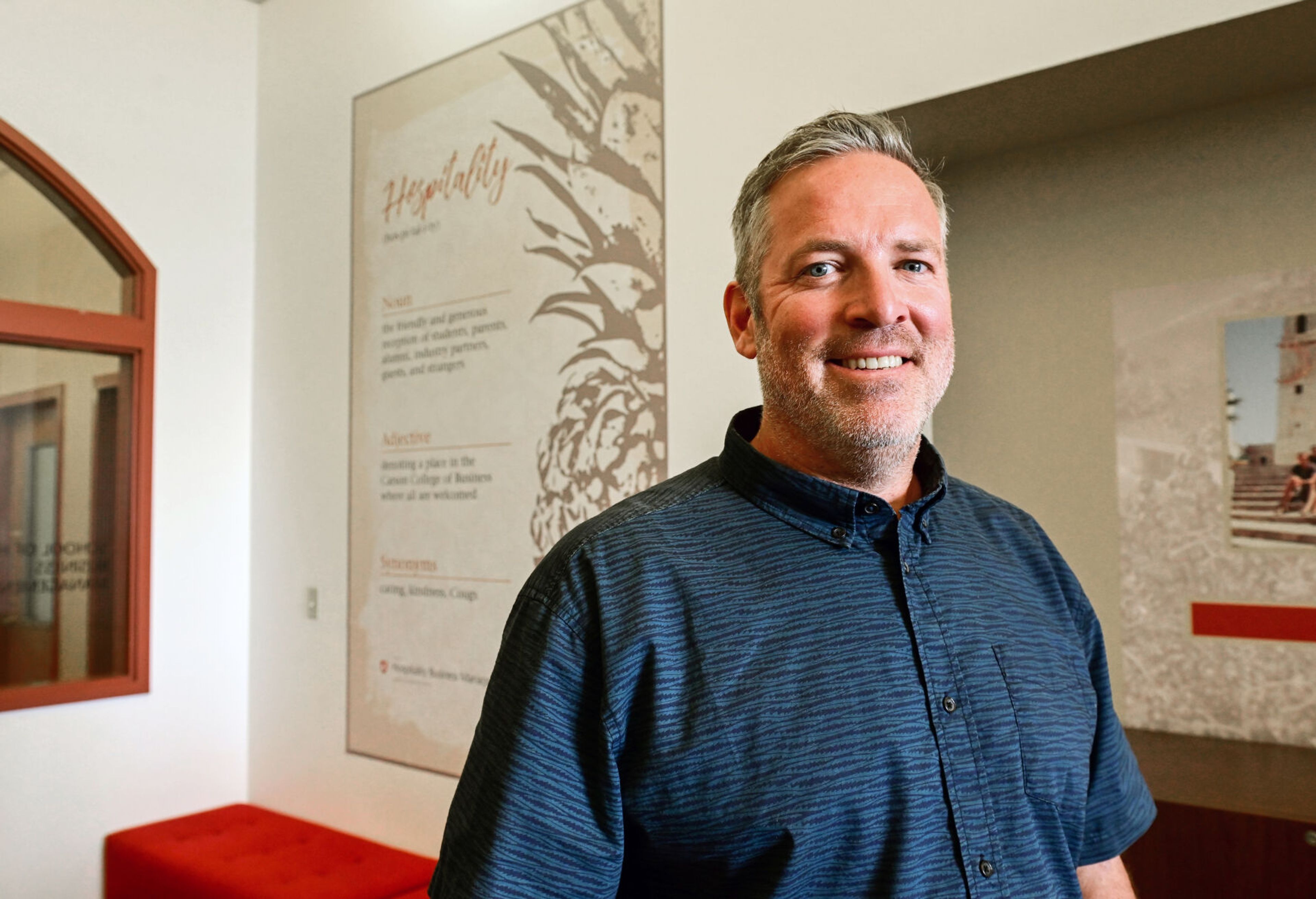 Jim Harbour, the recently appointed director for the School of Hospitality Business Management, stands in the school’s wing of Todd Hall on Washington State University campus on Monday.