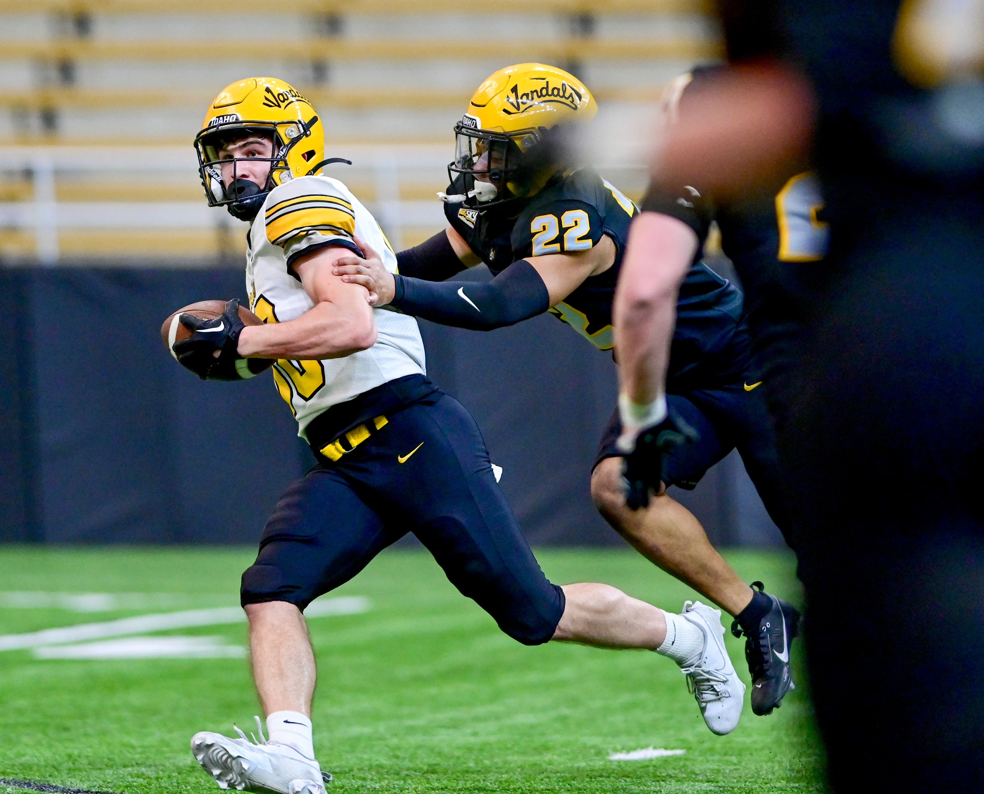 Vandals wide receiver Seth Shook, left, shakes off defensive back Dwayne McDougle, right, carrying the ball to the end zone for a touchdown during the annual spring game at the P1FCU Kibbie Dome in Moscow on Friday.