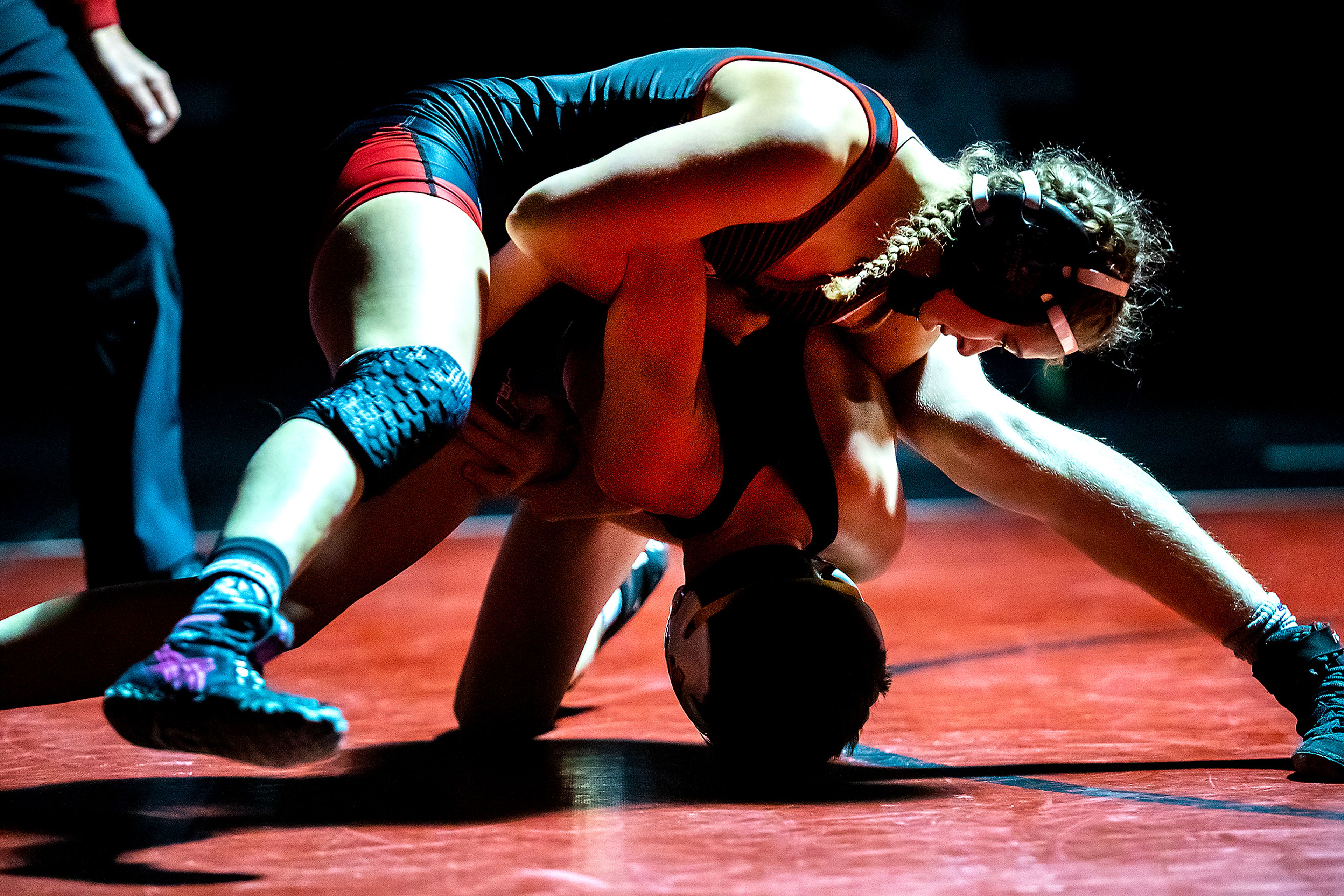 Moscow’s Skyla Zimmerman wrestles with Lewiston’s Jase Hendren in Moscow at a wrestling dual on Saturday, Dec. 11, 2021.