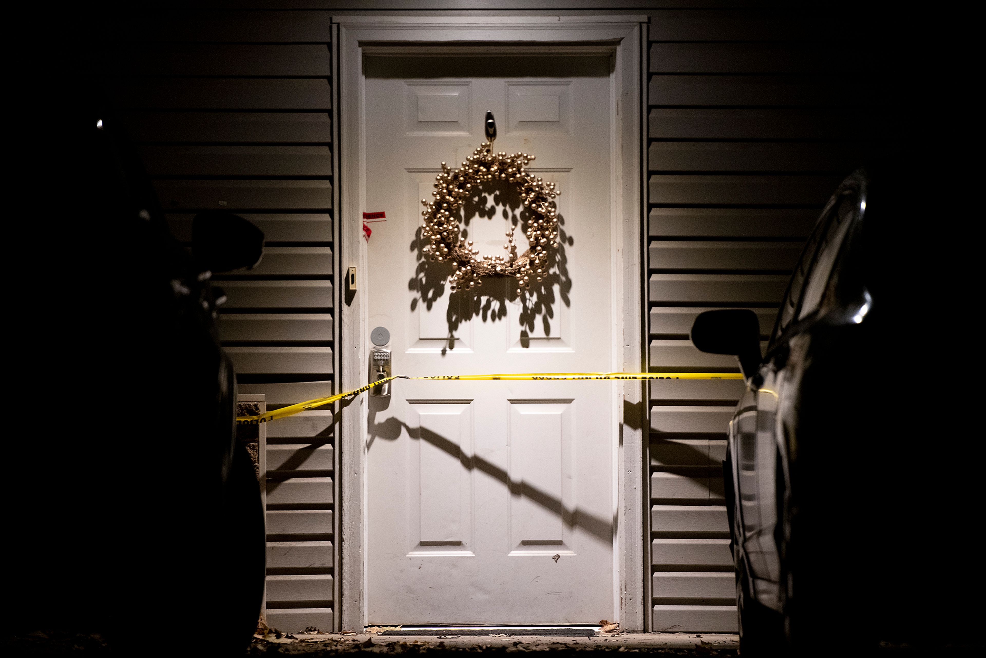 The front door of a suspected quadruple homicide location involving four University of Idaho students is cautioned off Wednesday in Moscow.