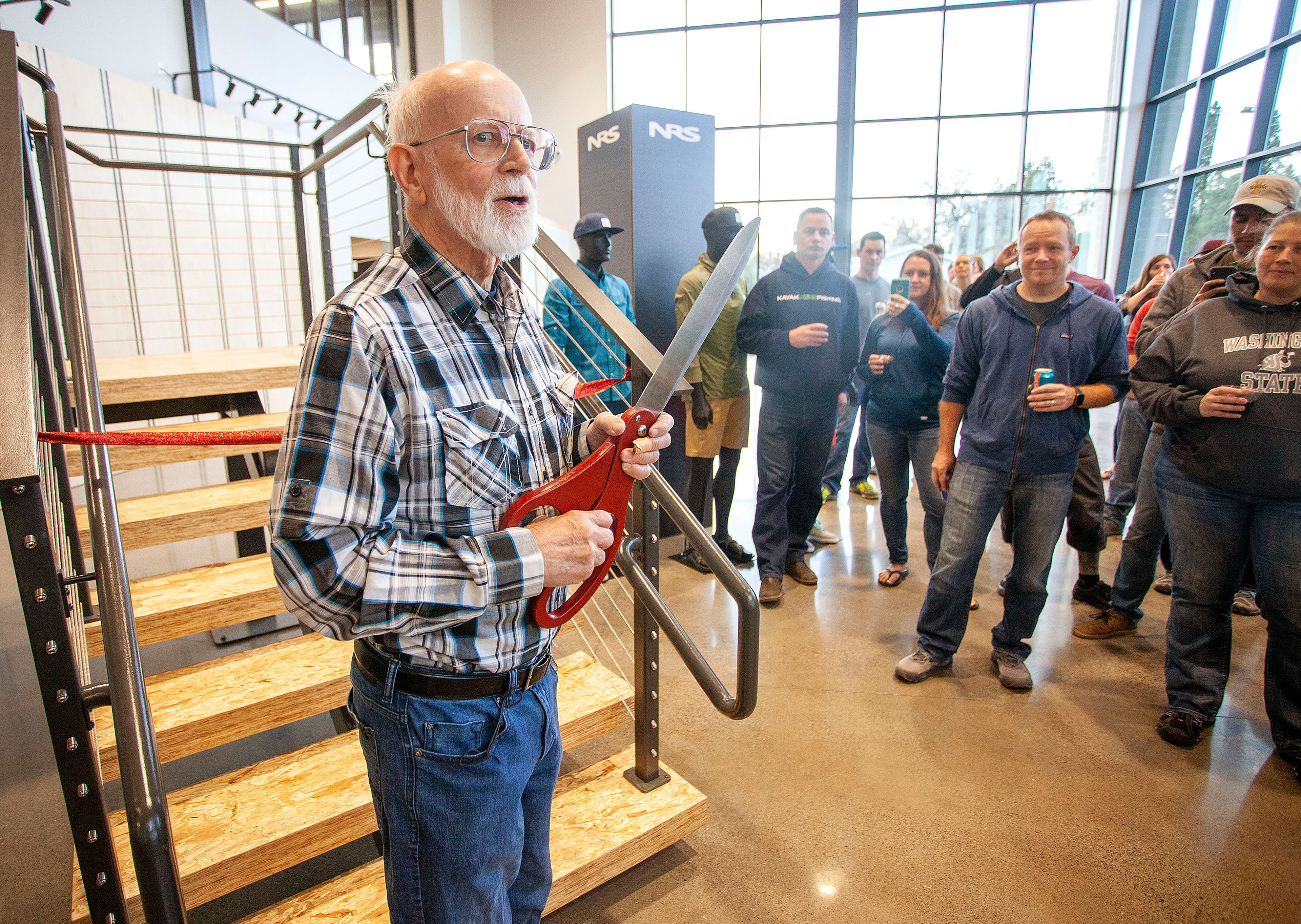 Company founder Bill Parks speaks during a ribbon cutting for the new Northwest River Supplies building Monday on South Blaine Street in Moscow. The business will start operating out of the building today, with the retail showroom scheduled to open Nov. 18. Parks started the business in 1972.