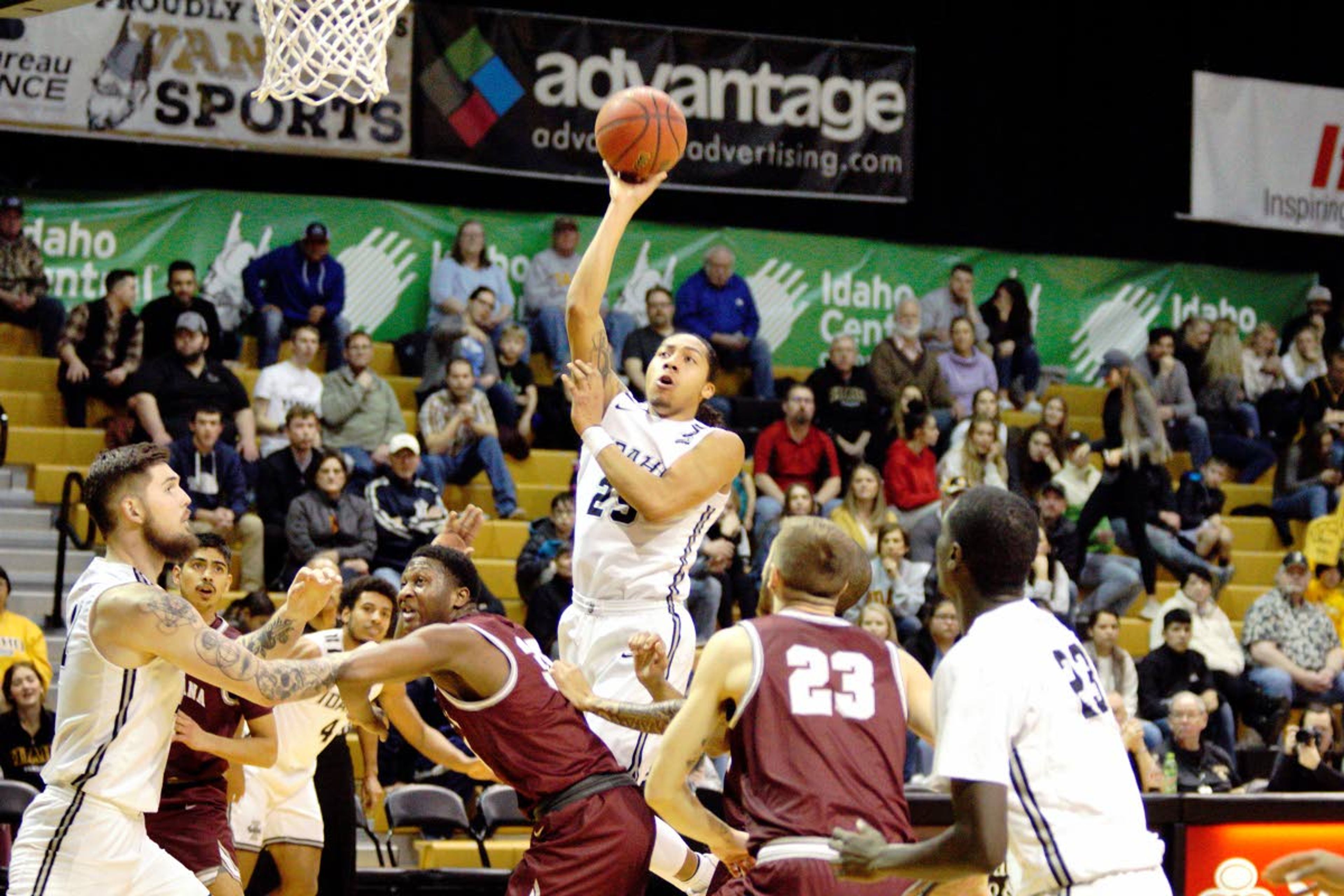 Idaho's Trevon Allen (25) puts up a short jumpshot during a Big Sky Conference game against Montana Saturday evening.