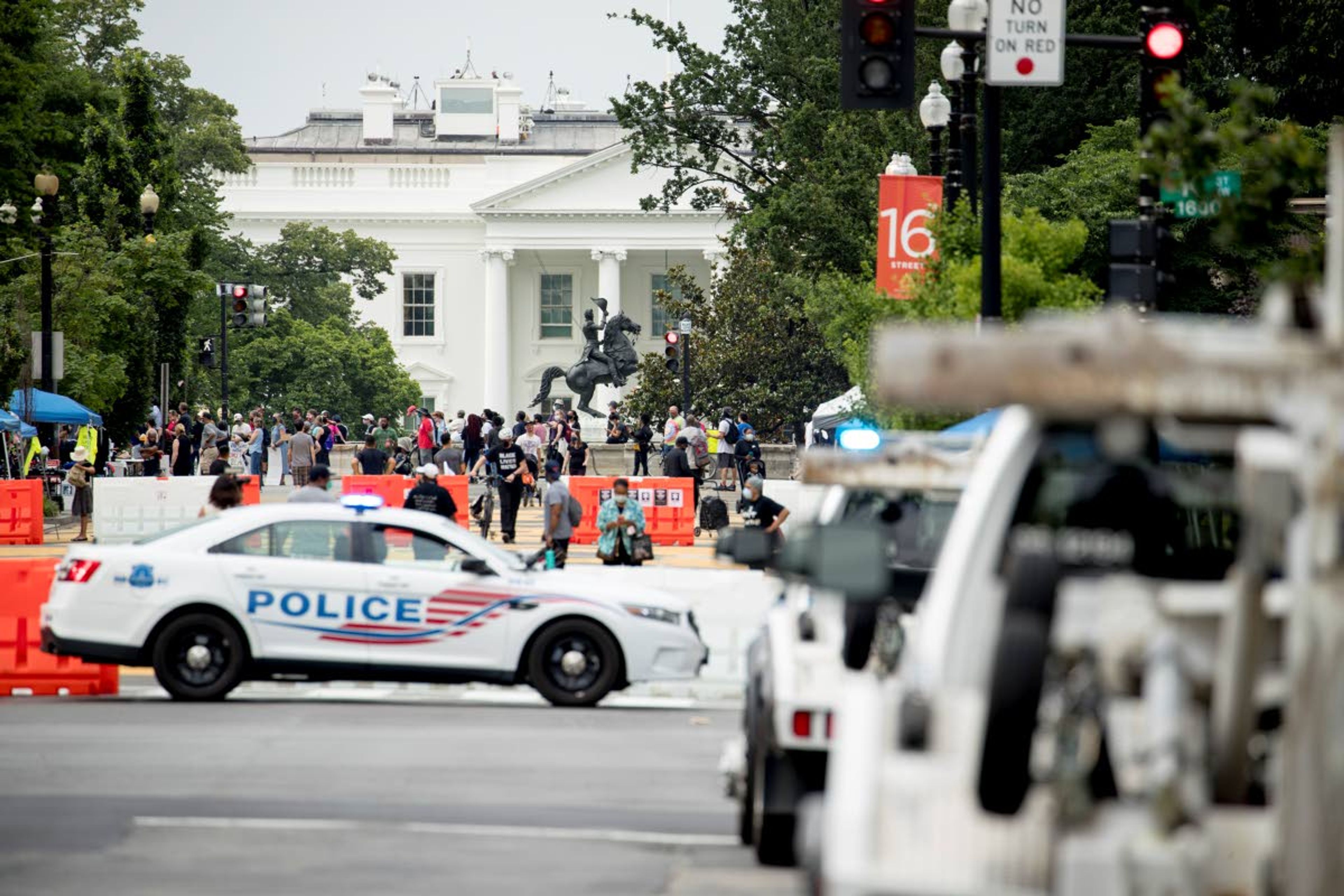 The White House is visible at 16th Street Northwest renamed Black Lives Matter Plaza, Friday, June 19, 2020, in Washington. (AP Photo/Andrew Harnik)