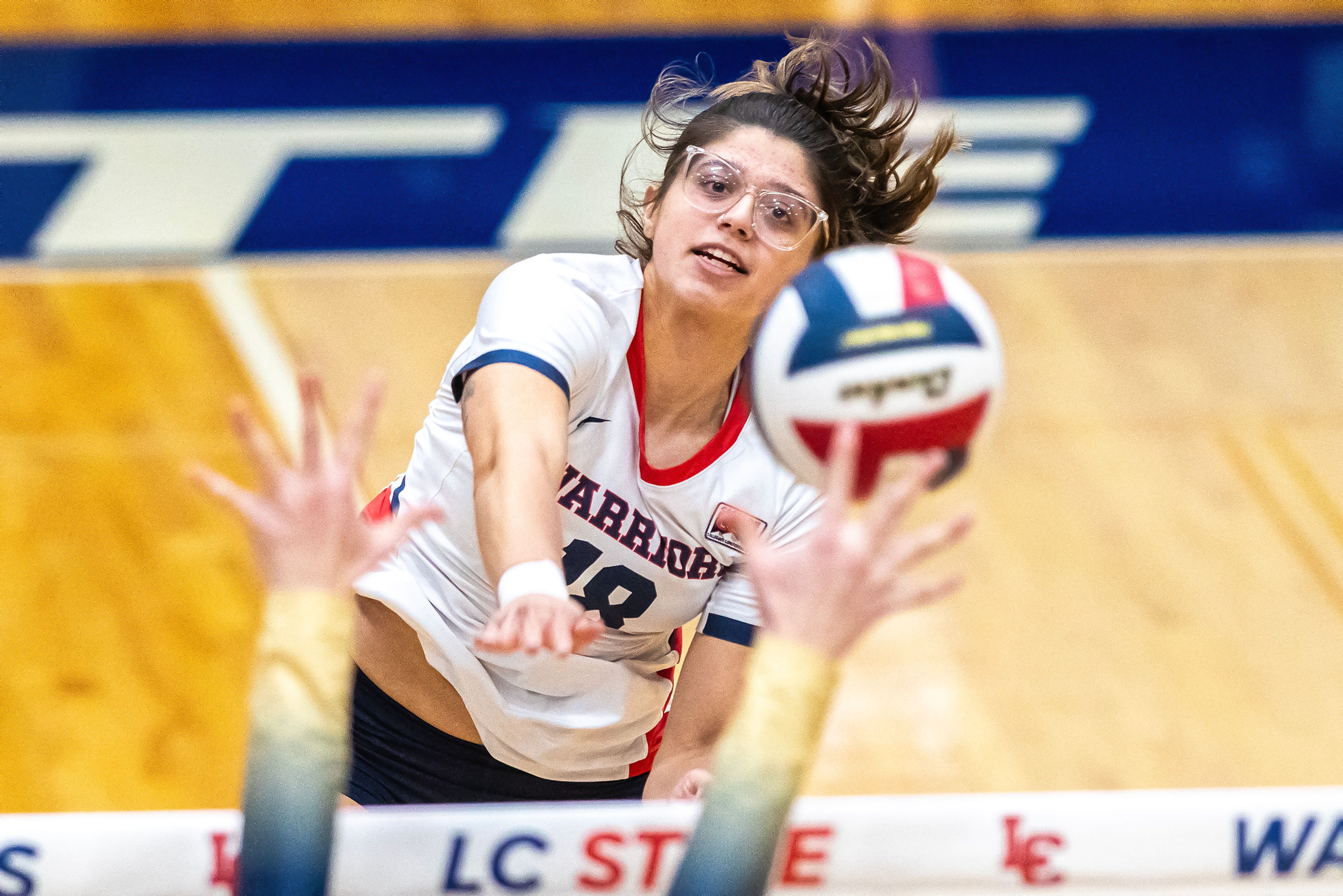 Lewis-Clark State outside hitter Juliauna Forgach Aguilar spikes the ball against Oregon Tech during a Cascade Conference Tournament play-in match Tuesday at the P1FCU Activity Center.