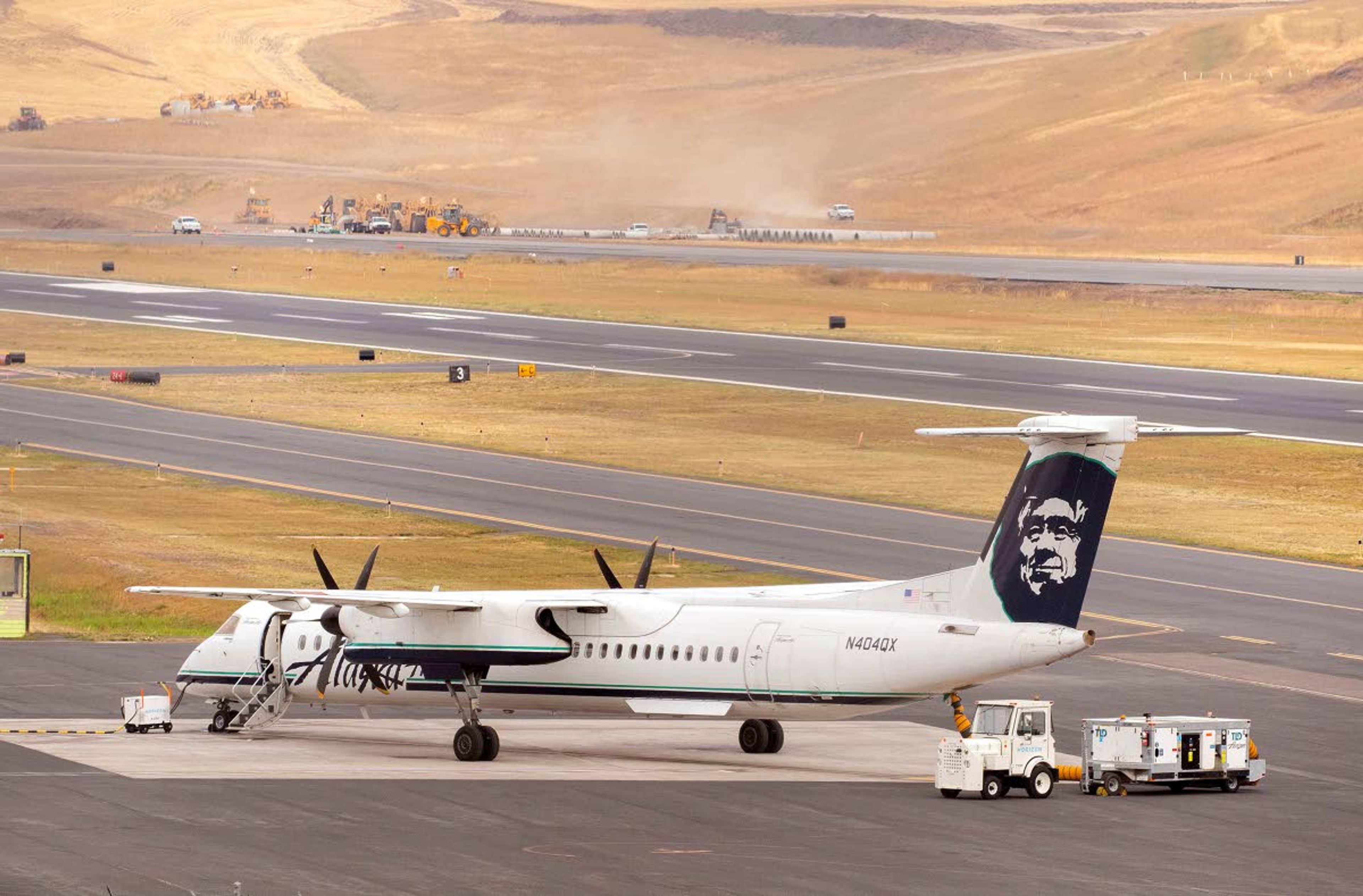 FILE — An Alaska Airlines airplane sits outside the terminal at the Pullman-Moscow Regional Airport in this 2019 file photo.