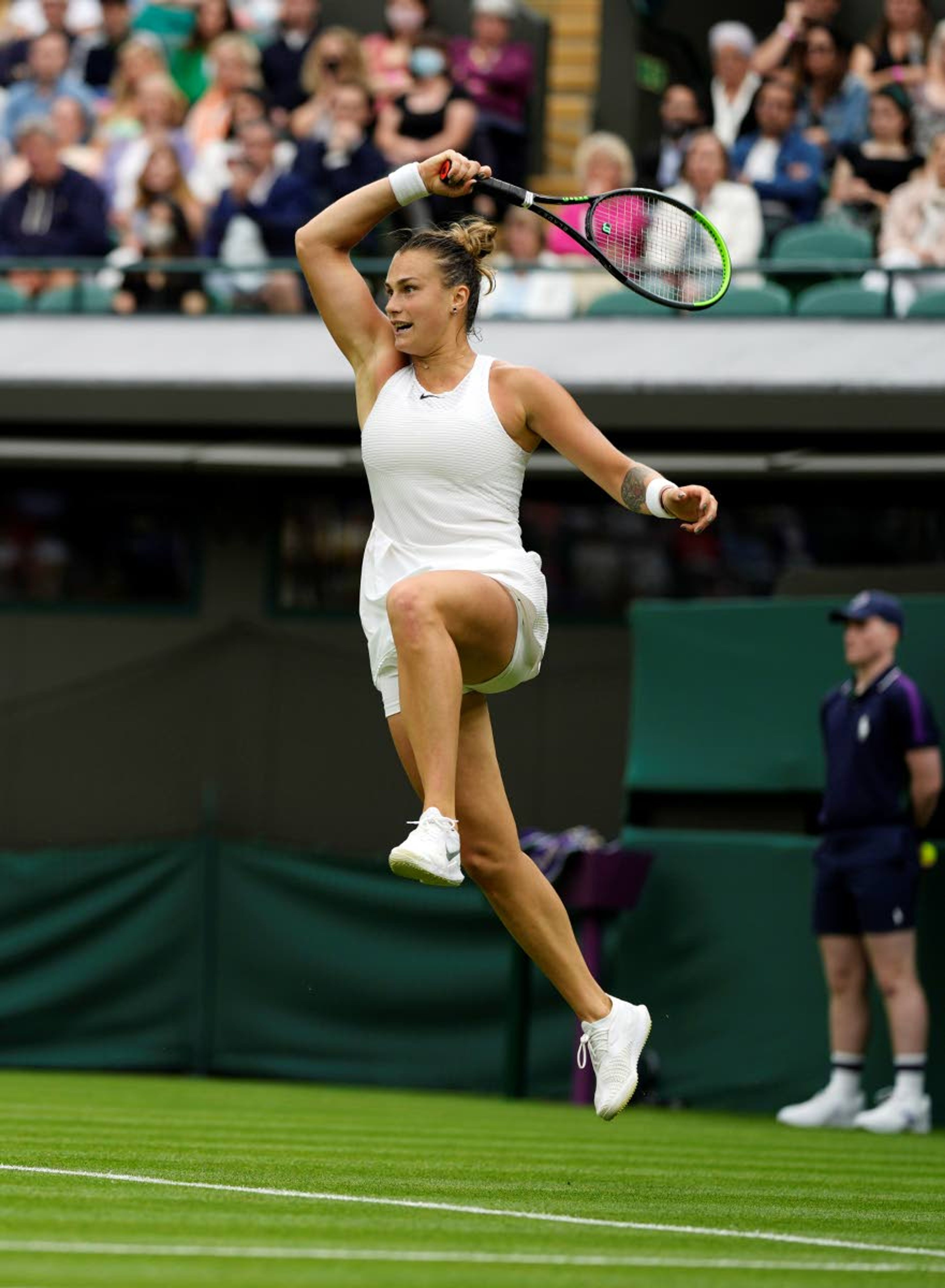 Belarus's Aryna Sabalenka returns a ball to Romania's Monica Niculescu during their first round women's singles match on day one of the Wimbledon Tennis Championships in London, Monday June 28, 2021. (AP Photo/Alastair Grant)