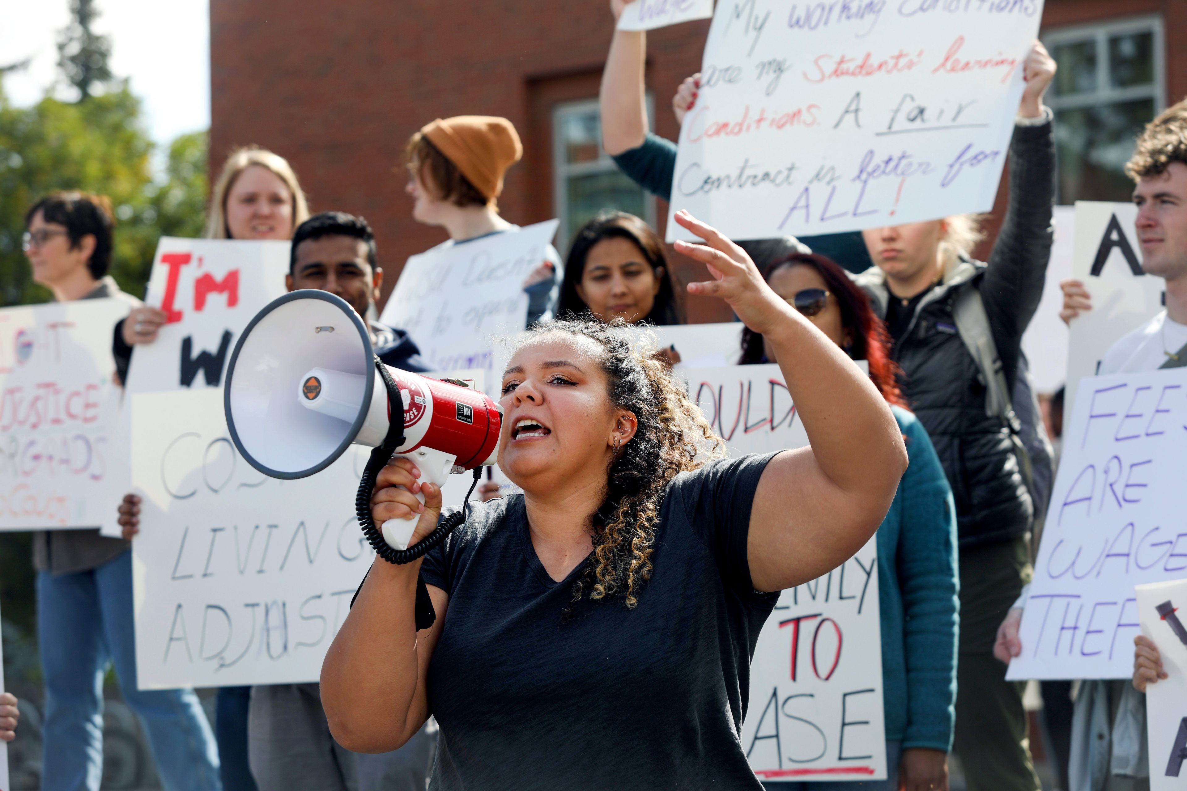 Sierra Forler, a second-year PhD student in biological sciences at Washington State University, speaks at a rally supporting contract negotiations for Academic Student Employees at Glenn Terrell Mall on Wednesday in Pullman.