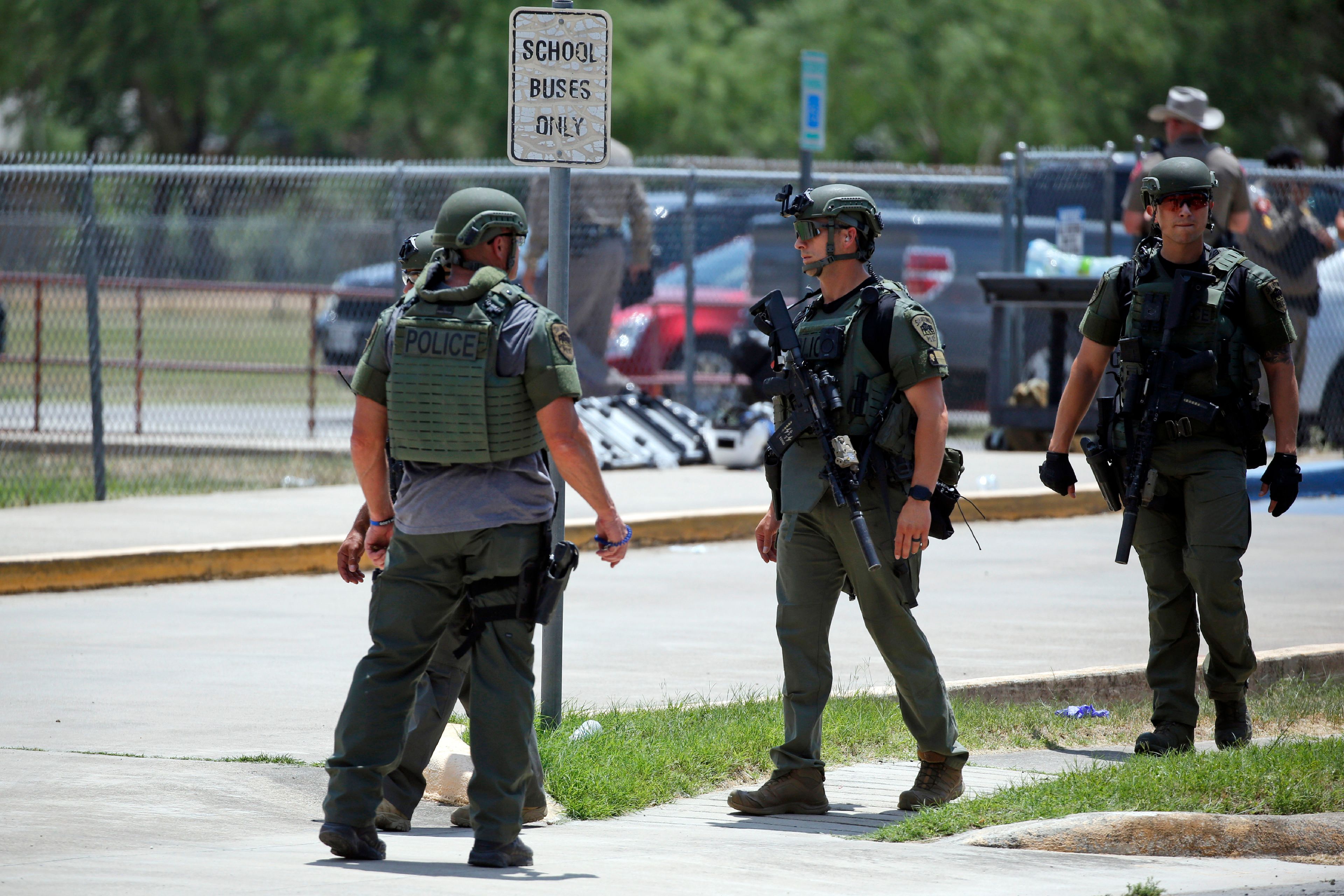 Law enforcement personnel stand outside Robb Elementary School following a shooting, Tuesday, May 24, 2022, in Uvalde, Texas. (AP Photo/Dario Lopez-Mills)