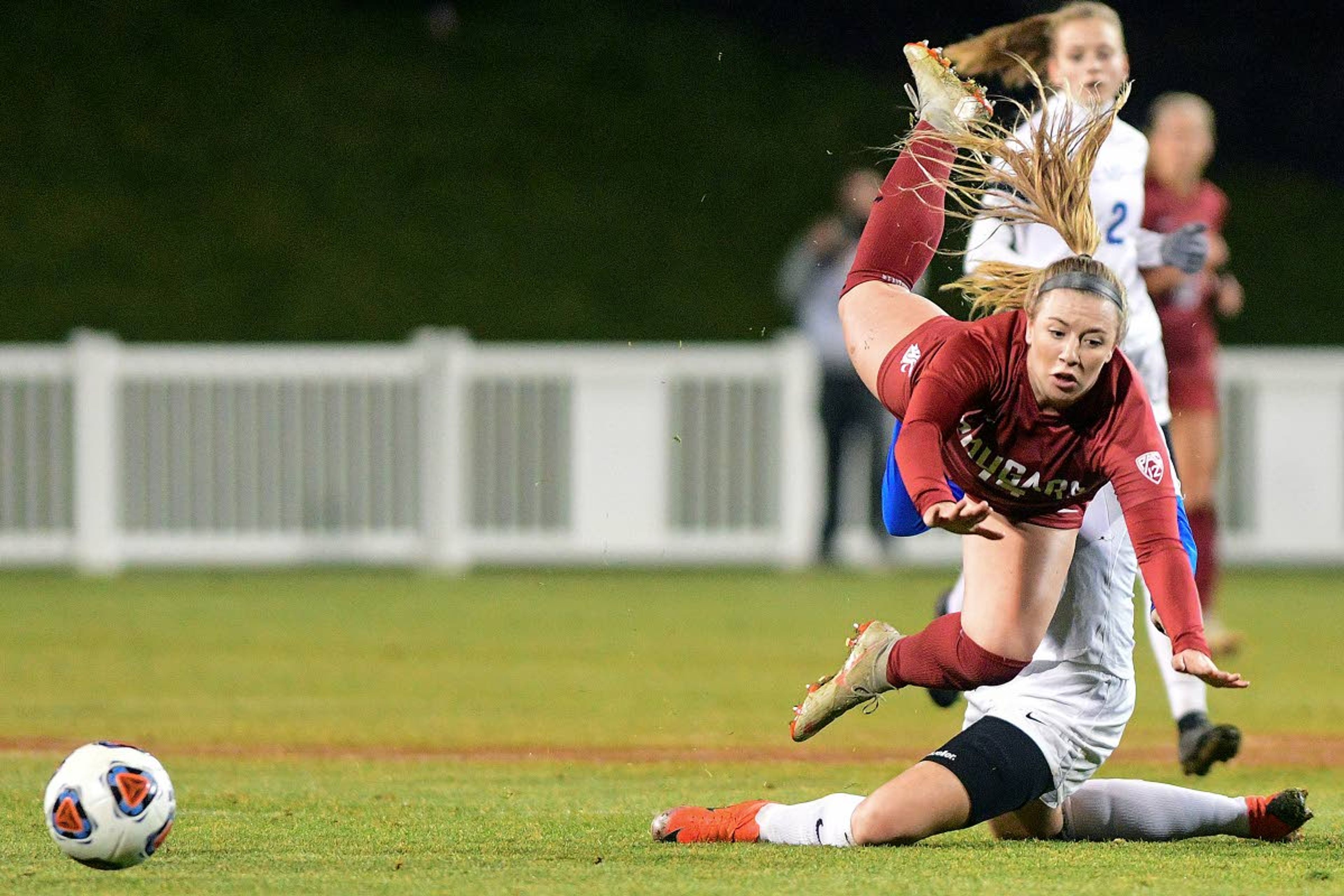 Washington State forward Molly Myers is fouled by defender Memphis Kimberley Smit in the first half of a first-round NCAA women’s soccer tournament game Nov. 15 in Pullman. The college sports organization has made moves to hold its fall sports championships, like women’s soccer, in the spring when the coronavirus pandemic may be under better control.