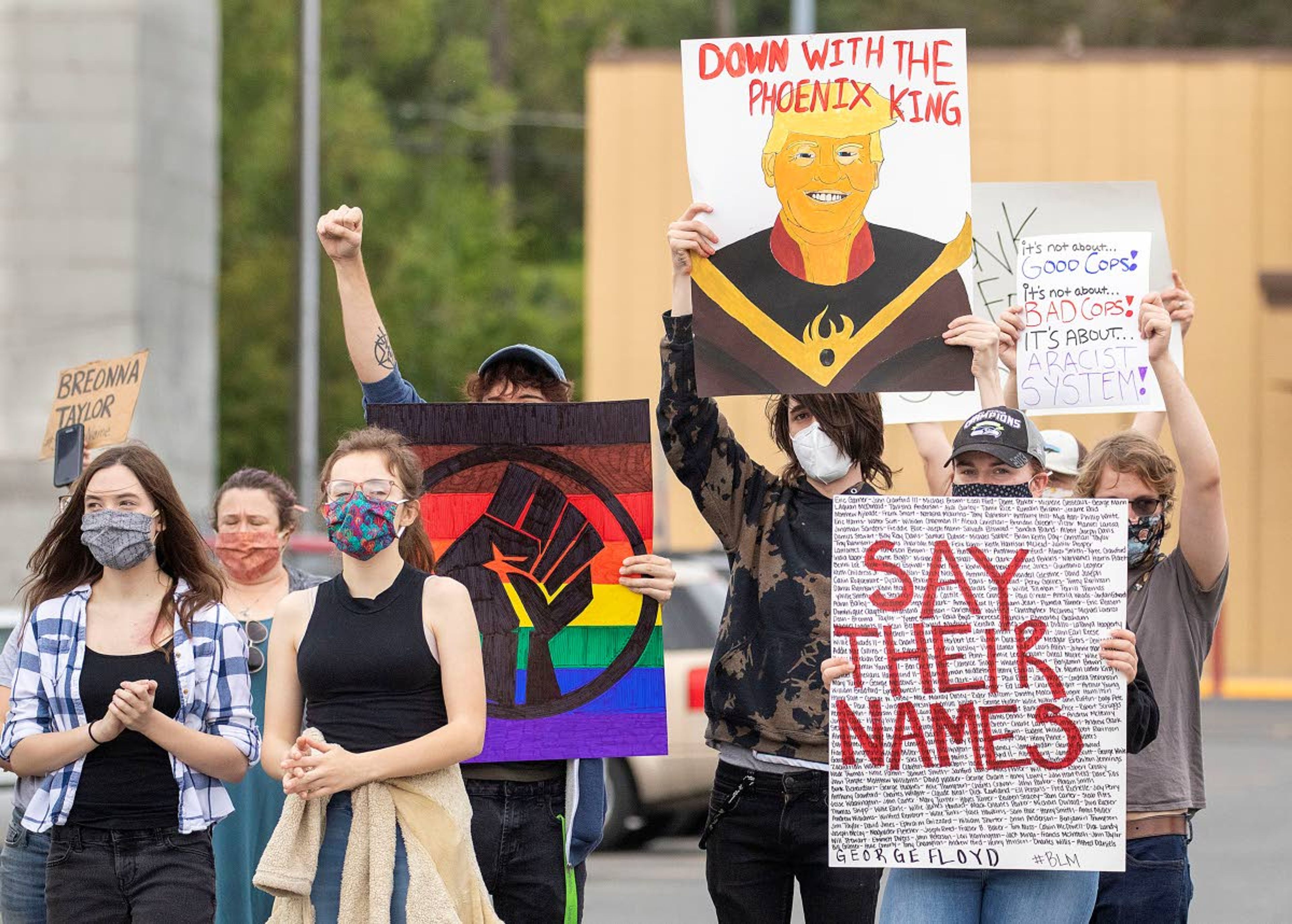 Protesters hold signs and chant during a demonstration over the death of George Floyd on Friday at the intersection of D and Main streets in Moscow. More than 50 people participated in the demonstration.