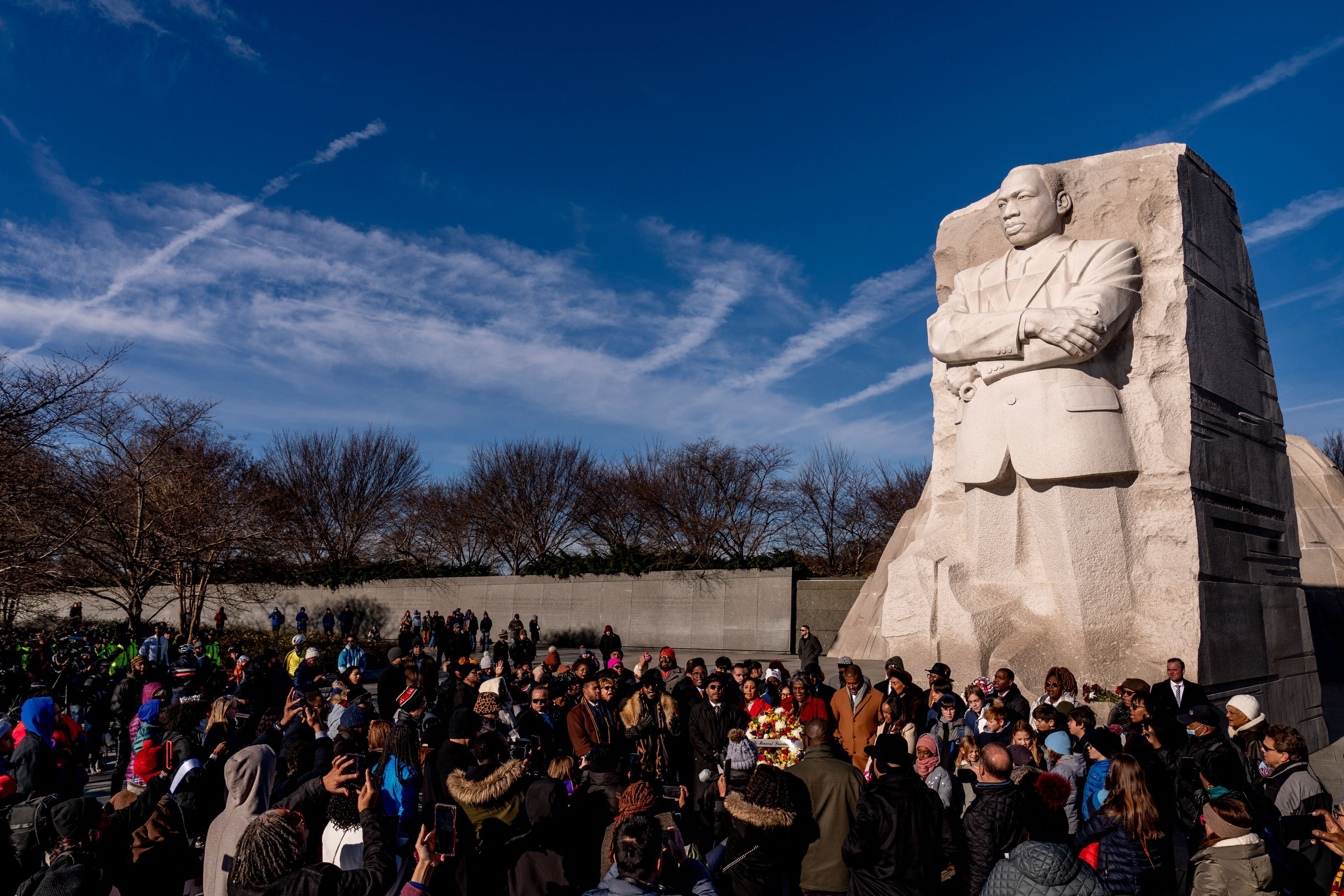 A large group gathers to watch a wreath-laying ceremony at the Martin Luther King Jr. Memorial on Martin Luther King Jr. Day in Washington, Monday, Jan. 16, 2023. (AP Photo/Andrew Harnik)