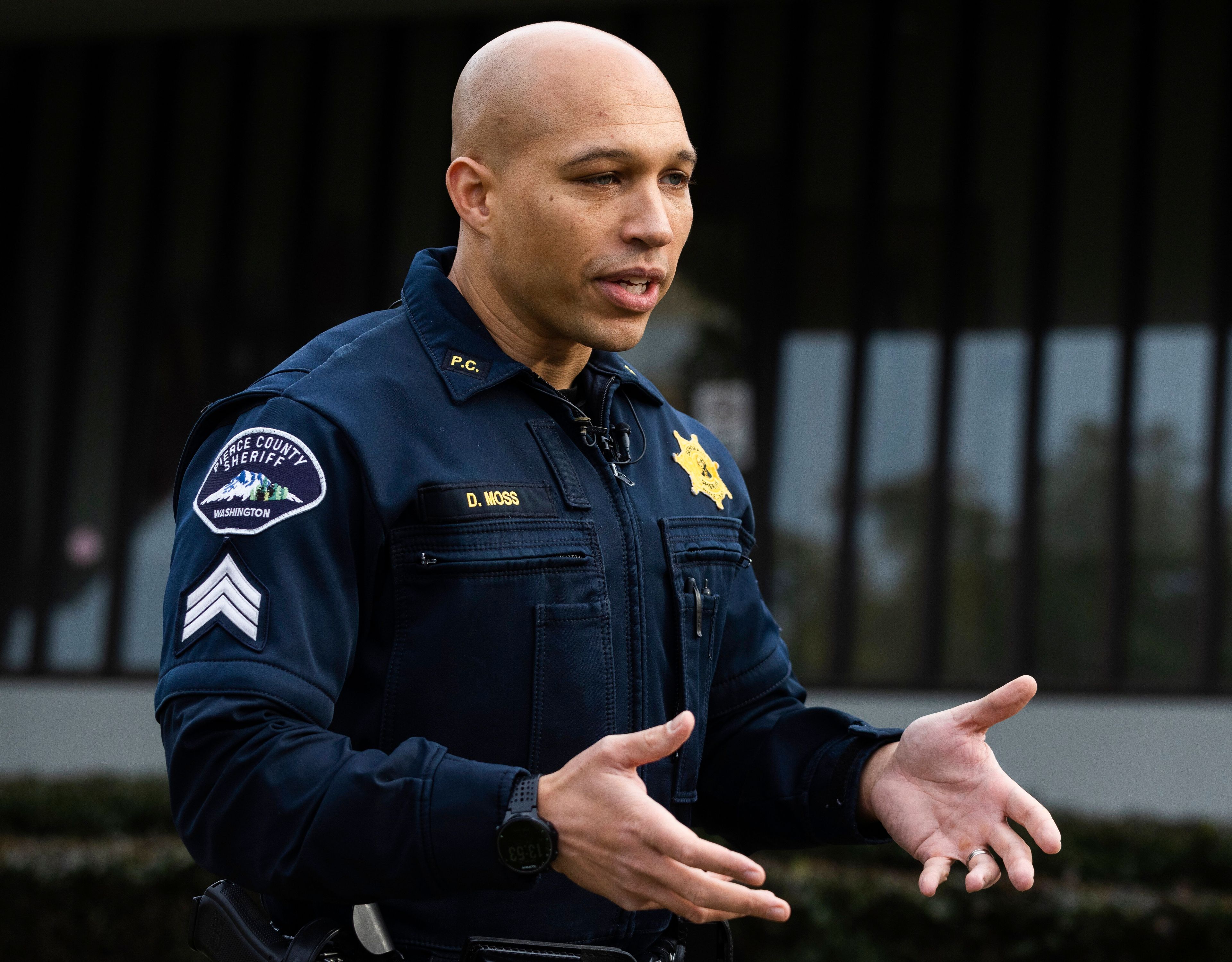 Sergeant Darren Moss Jr., Public Information Officer with the Pierce County Sheriff's Department briefs the news media after electrical substations were damaged by vandals early on Christmas morning, Sunday, Dec. 25, 2022 in Graham, Wa. (Ken Lambert/The Seattle Times via AP)