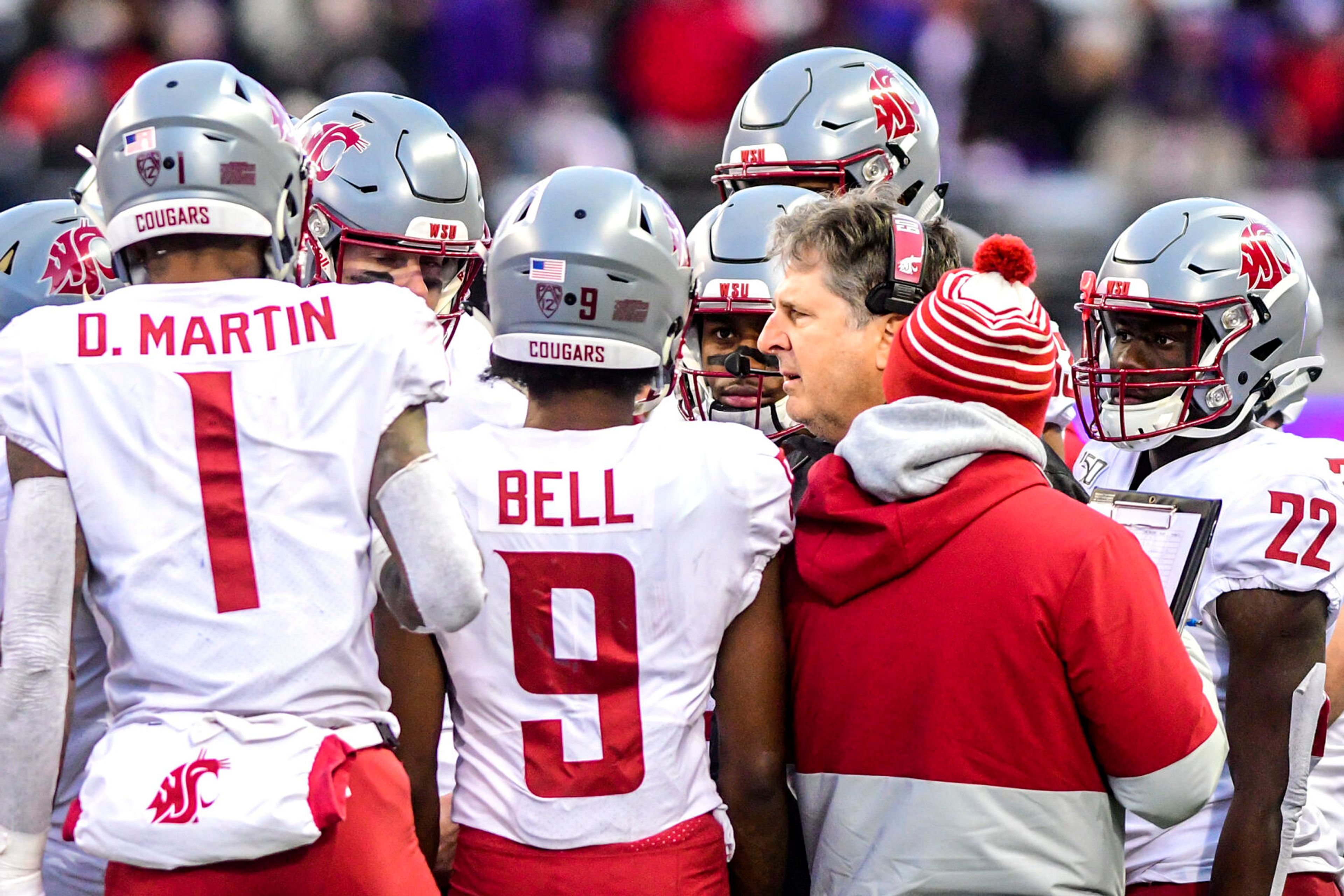 Mike Leach talks to his team during a Pac-12 Conference game against Washington on Nov. 29, 2019, at Husky Stadium in Seattle.