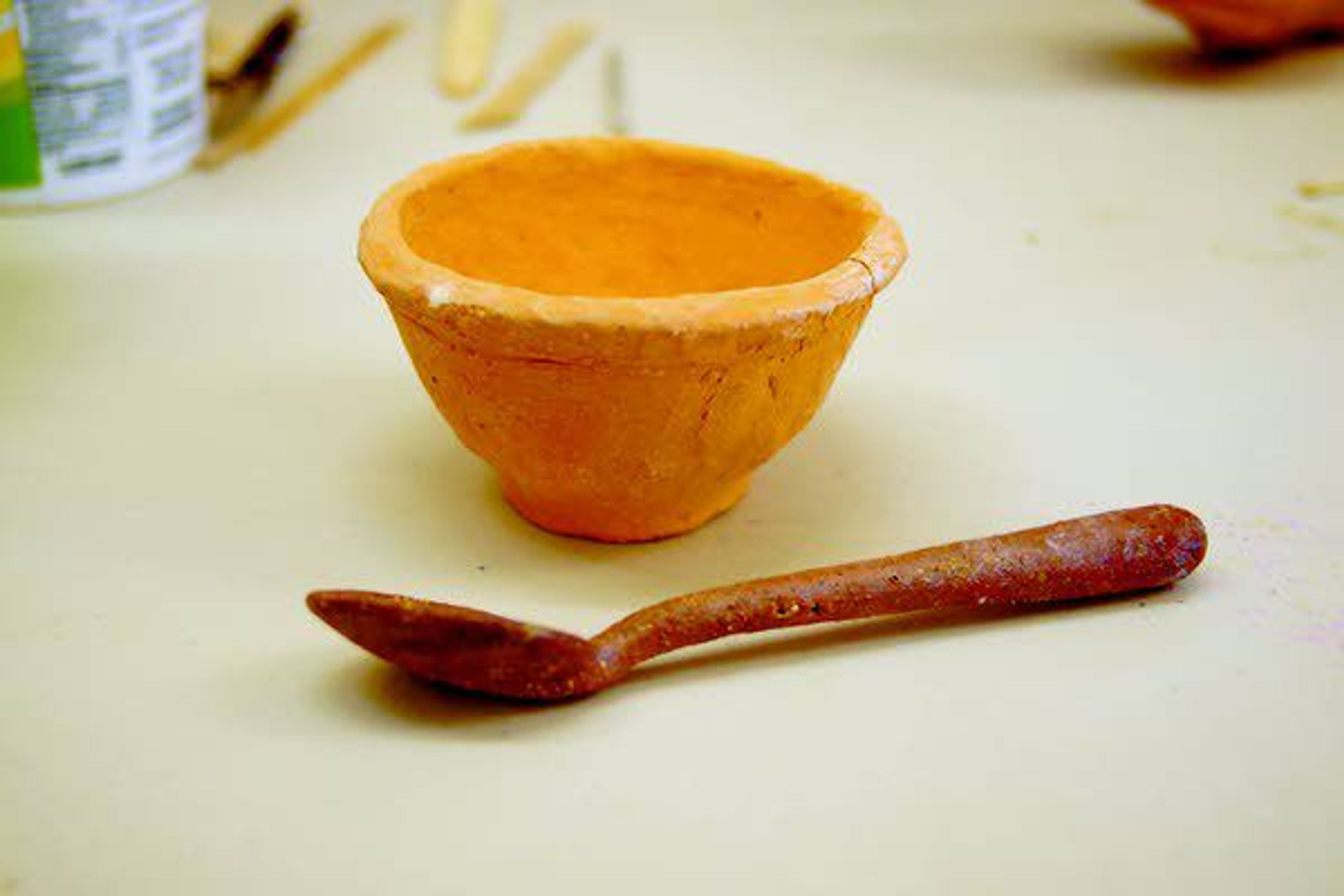 This pinch pot and spoon, made from clumping cat litter, which is benzonite clay, were made by Josh Kirby.