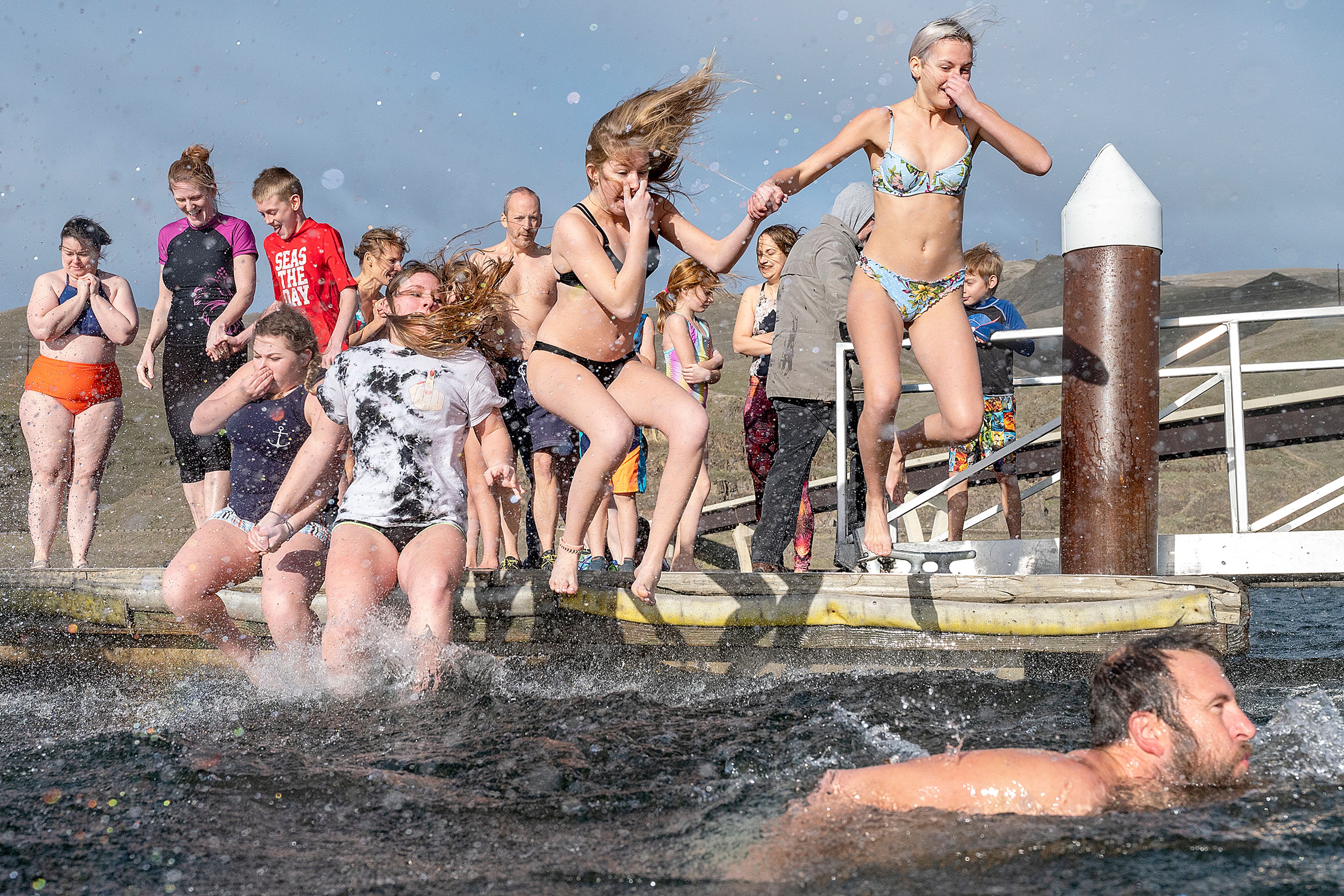 Jump then swim as fast as possible to the shore is the strategy for most of the people who participated in the annual Polar Plunge on Wednesday in Clarkston.