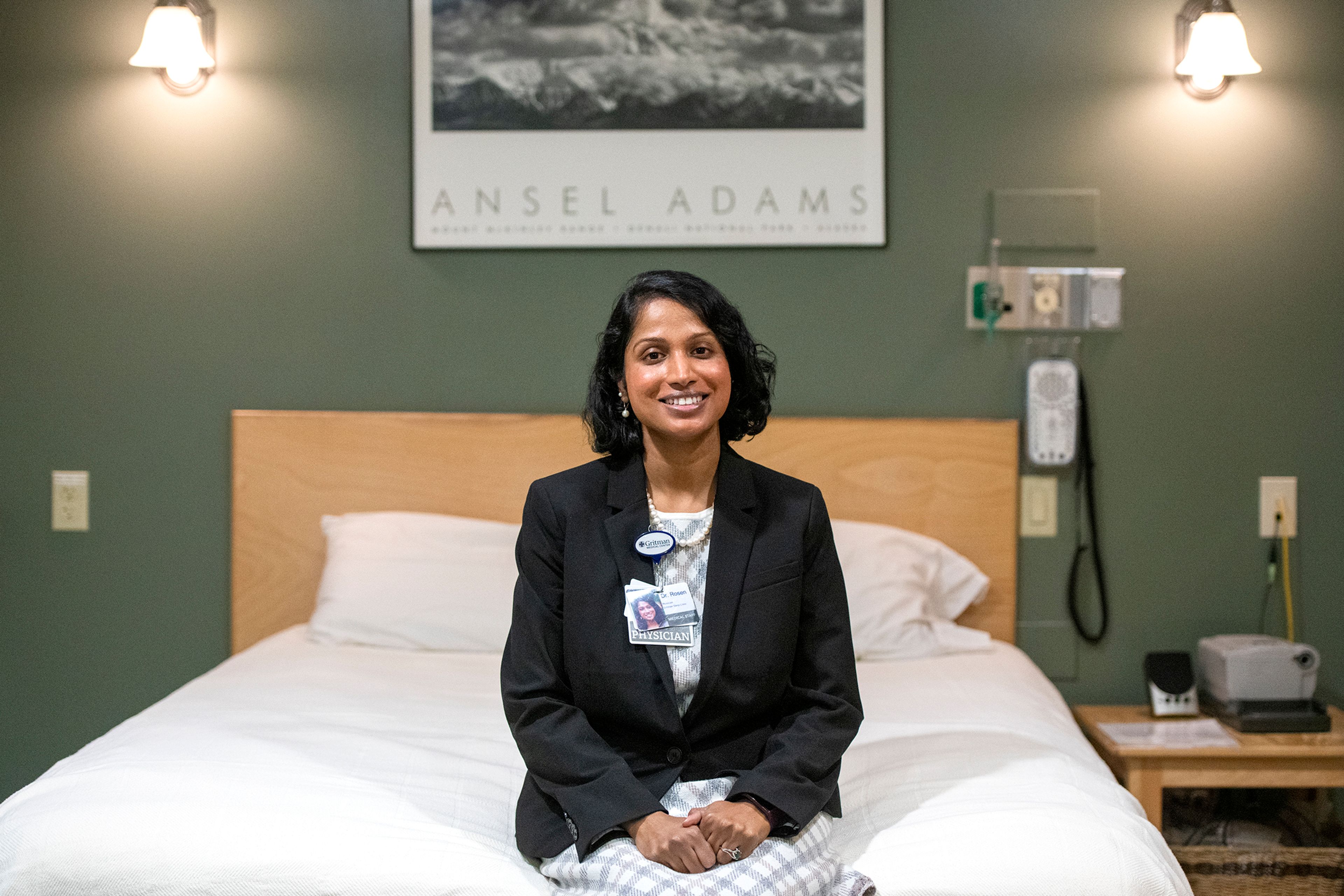 Dr. Preetha Rosen sits on the edge of a bed inside one of the two sleep suites at Gritman Medical Center in Moscow.