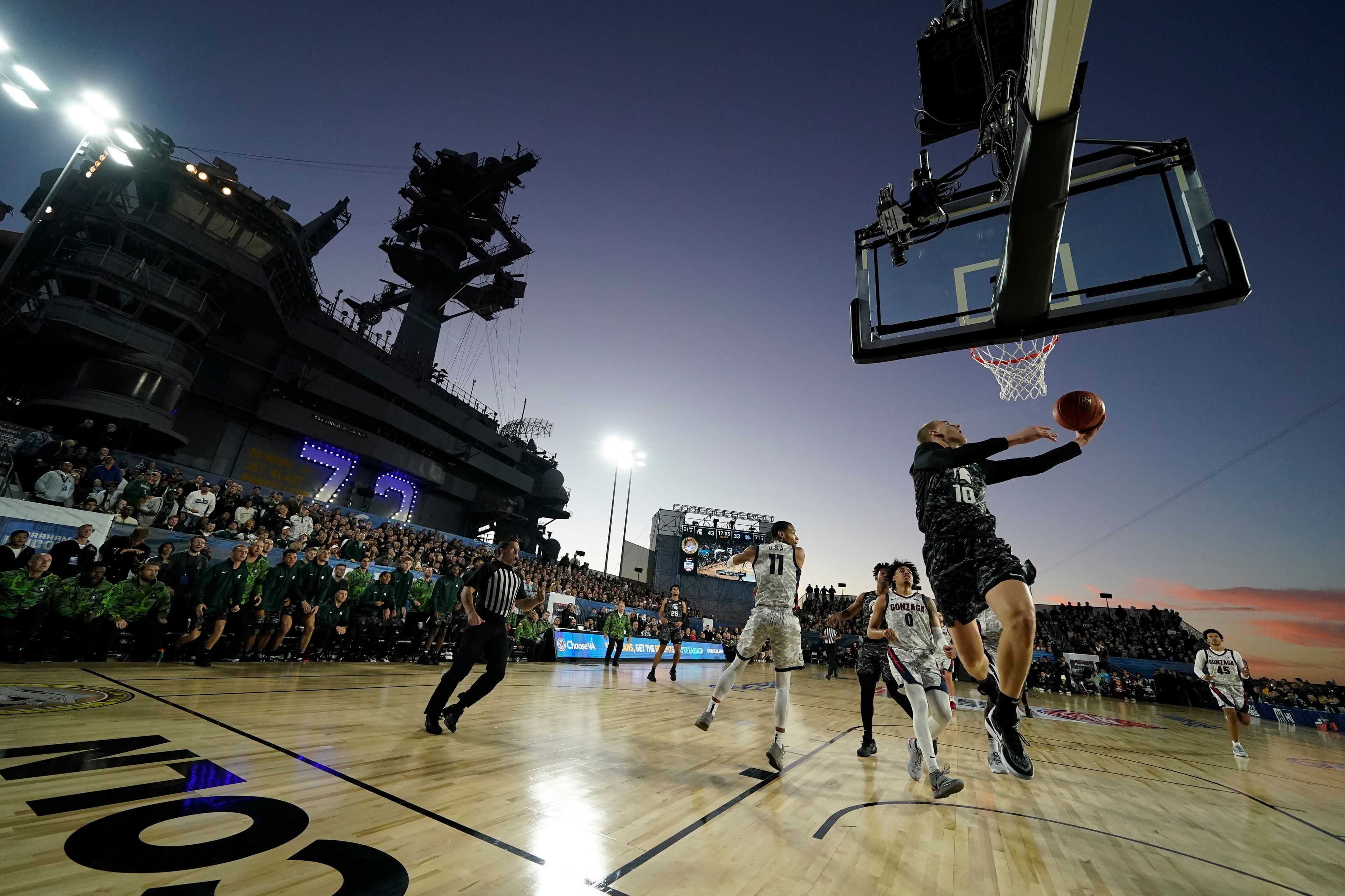 Michigan State forward Joey Hauser (10) shoots during the second half of the Carrier Classic NCAA college basketball game against Gonzaga aboard the USS Abraham Lincoln in Coronado, Calif. Friday, Nov. 11, 2022. (AP Photo/Ashley Landis)