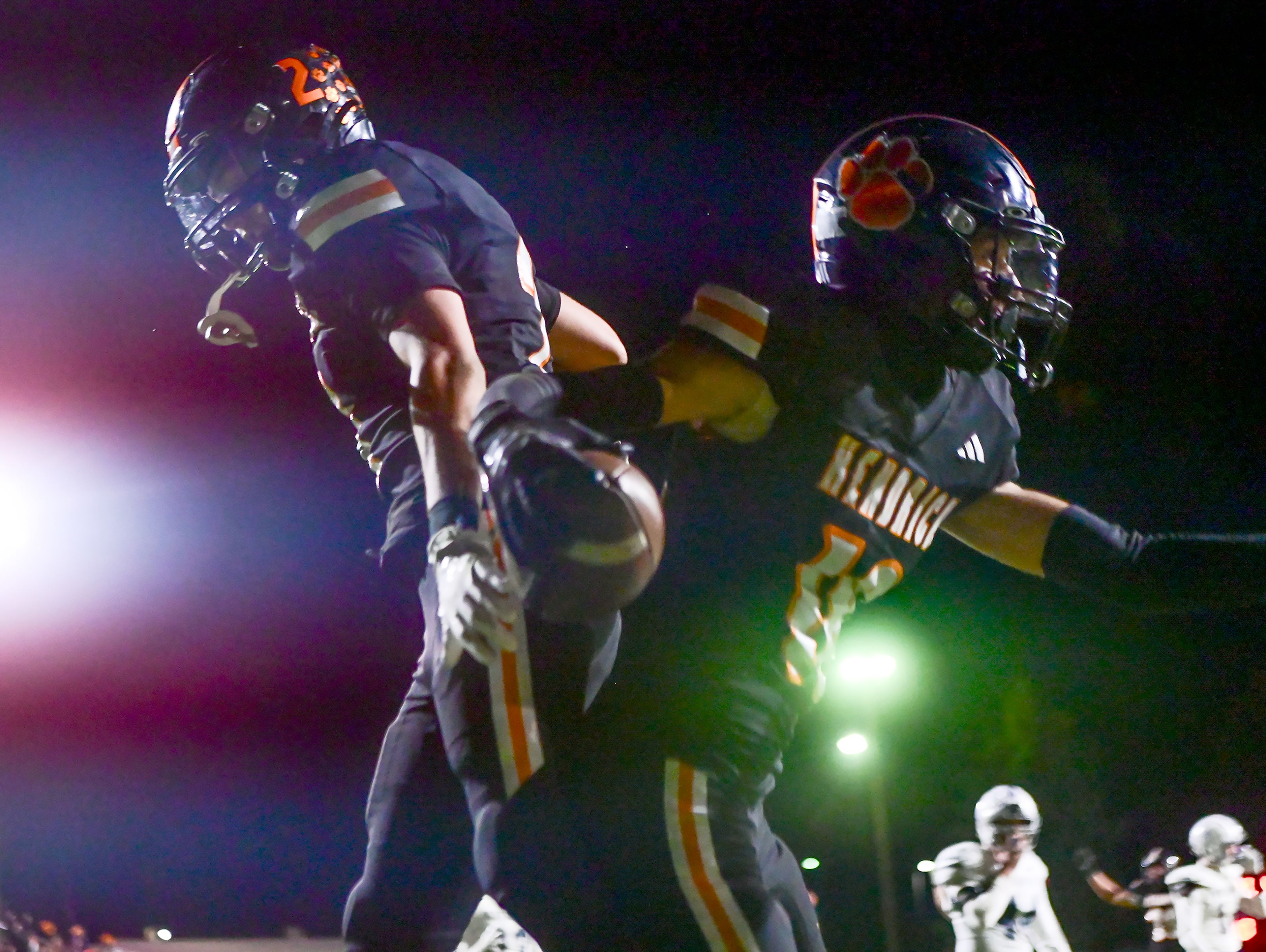 Kendrick�s Ralli Roetcisoender and Cade Silflow celebrate Silflow�s touchdown against Logos Friday in Kendrick.,