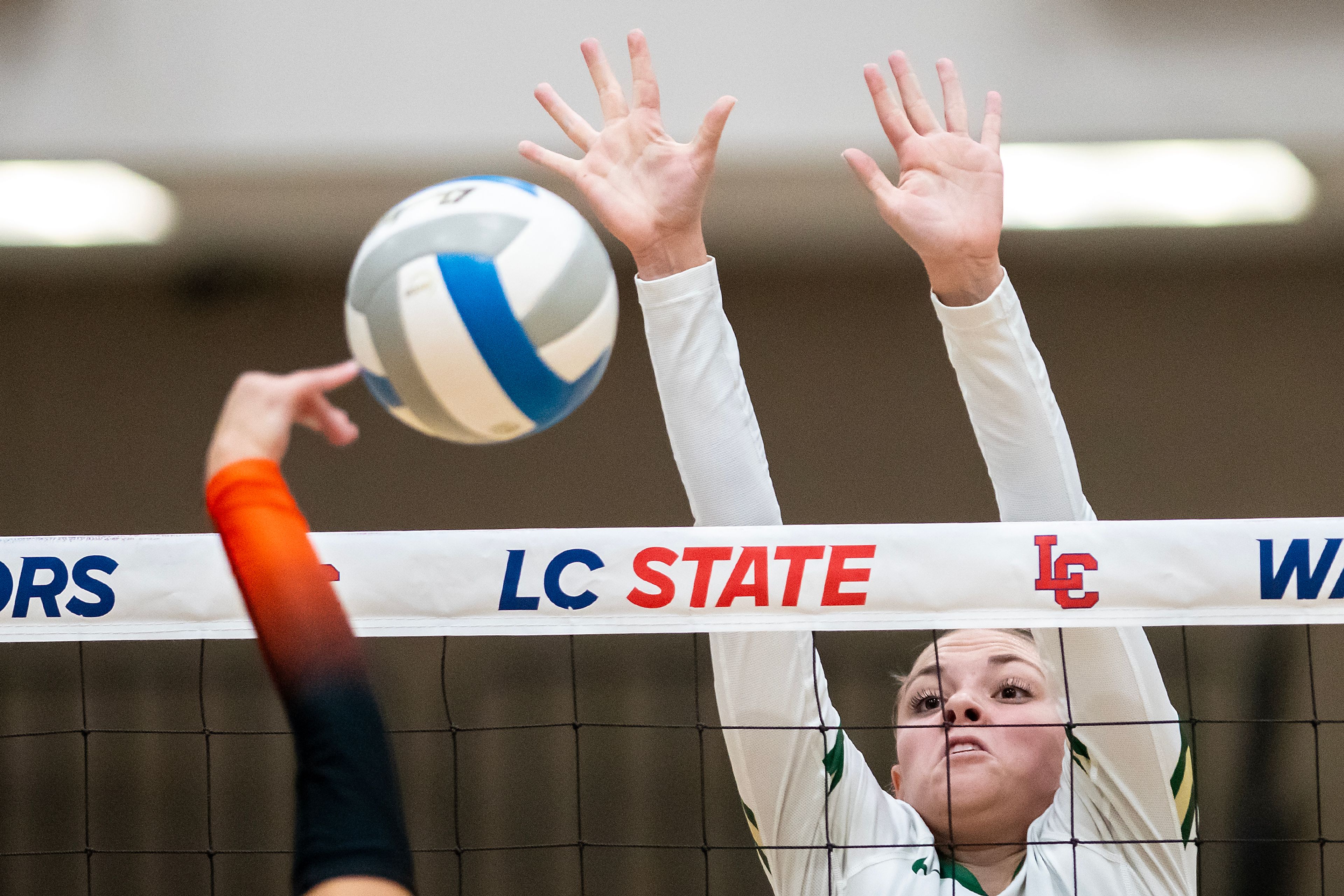 Potlatch middle blocker Brooklyn Mitchell attempts to block a Troy spike during a 2A district championship Wednesday at the P1FCU Activity Center in Lewiston.