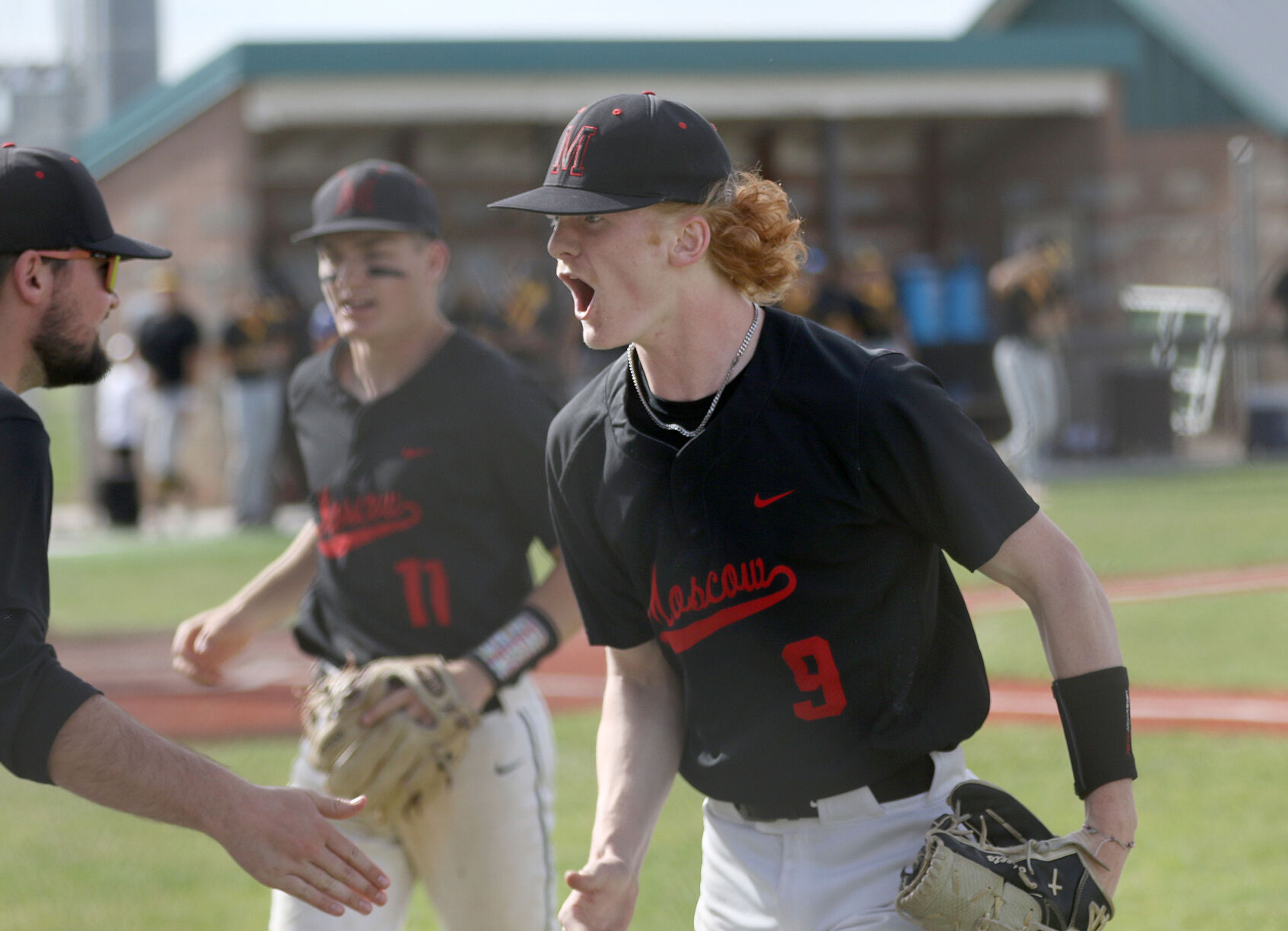 Moscow pitcher Keaton Clark (9) celebrates a strikeout against Bishop Kelly during the Idaho Class 4A state championship game Saturday at Vallivue High School in Caldwell, Idaho.