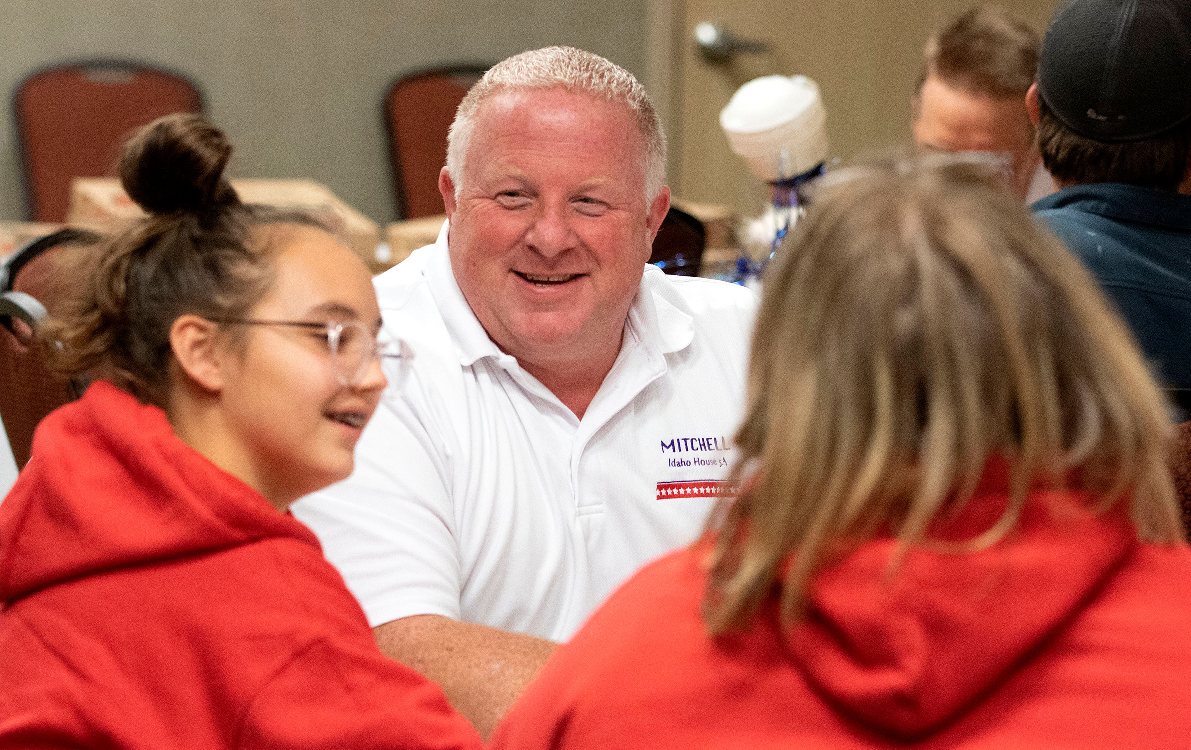 Legislative candidate Brandon Mitchell talks with his family during a during a Latah County Republicans election party on Tuesday at the Fairfield Inn and Suites in Moscow.