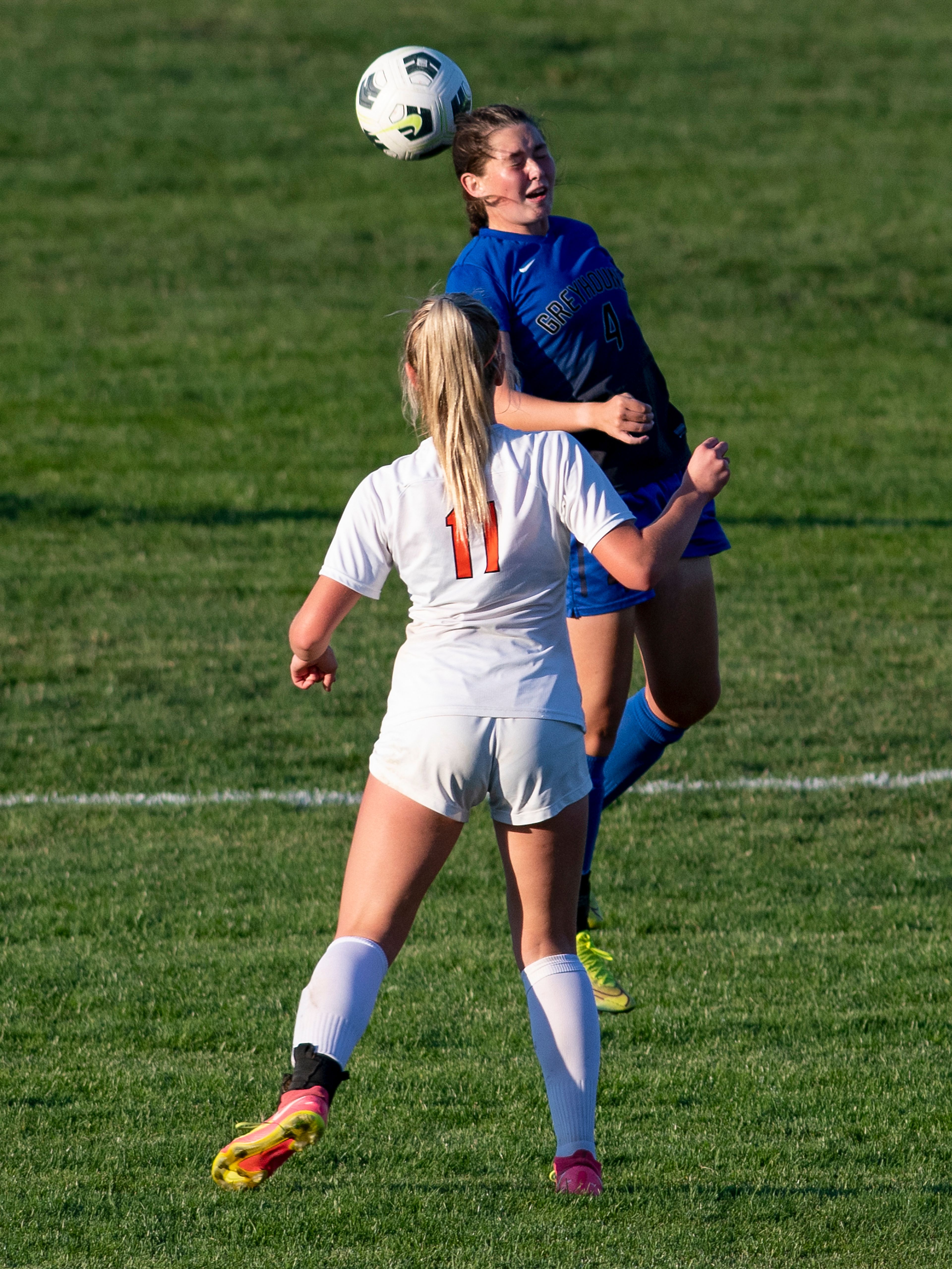 Pullman’s Keely Franklin (4) heads the ball over West Valley’s Ashlyn Chase (11) during a Class 2A Greater Spokane League game at Pullman High School on Tuesday.