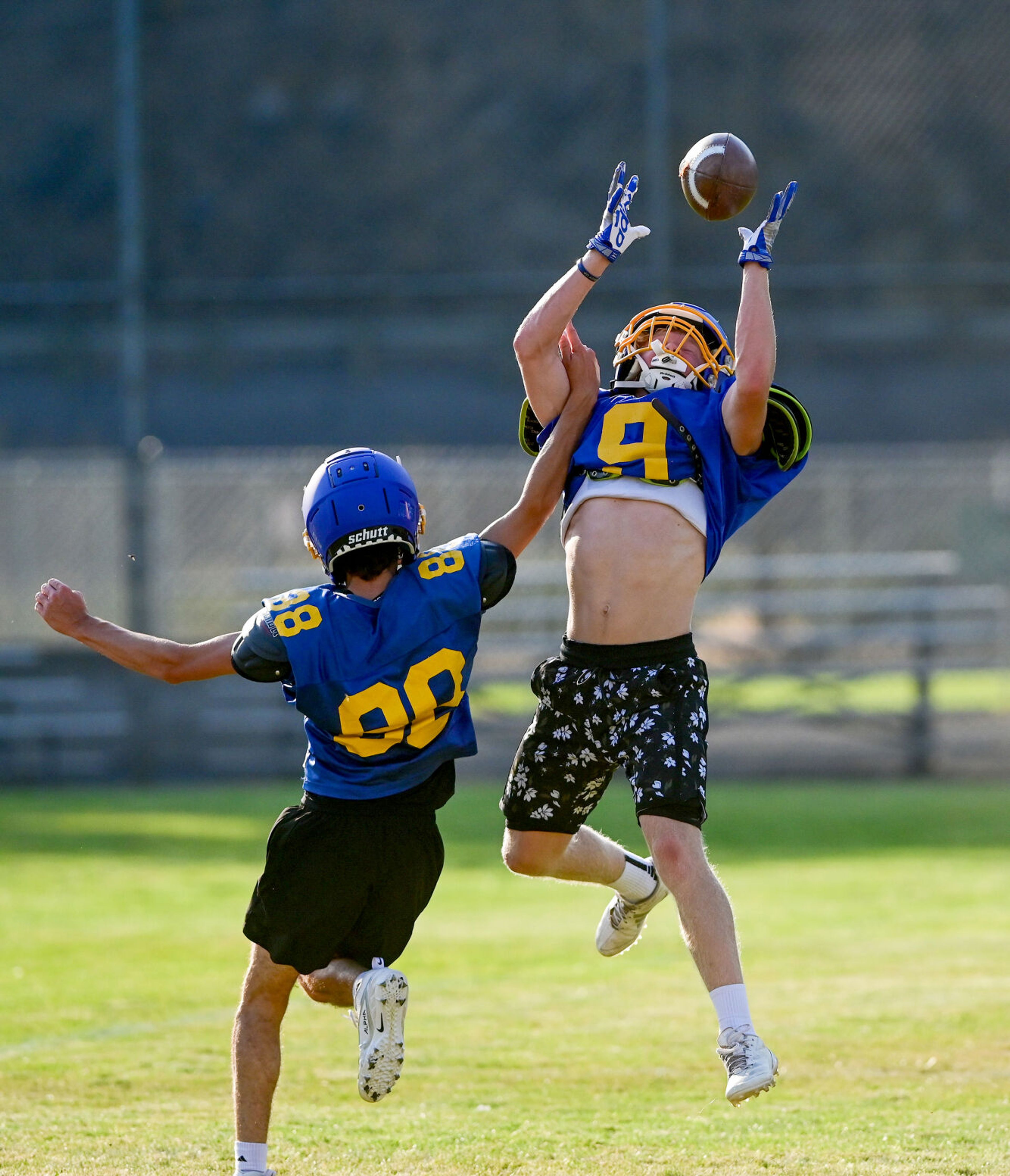 Colfax senior receiver Zachary Cooper jumps to catch a pass at practice on Tuesday.