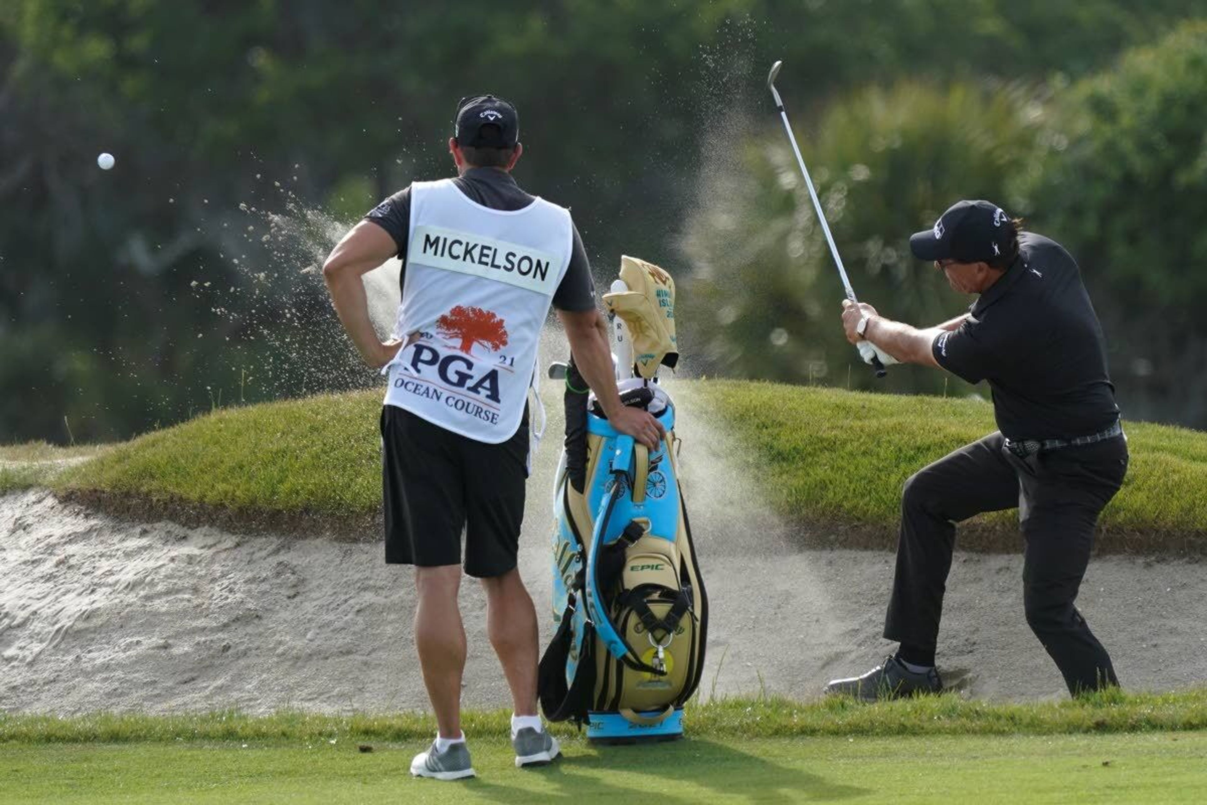 Phil Mickelson works out a bunker on the 12th hole during the third round at the PGA Championship golf tournament on the Ocean Course, Saturday, May 22, 2021, in Kiawah Island, S.C. (AP Photo/Matt York)