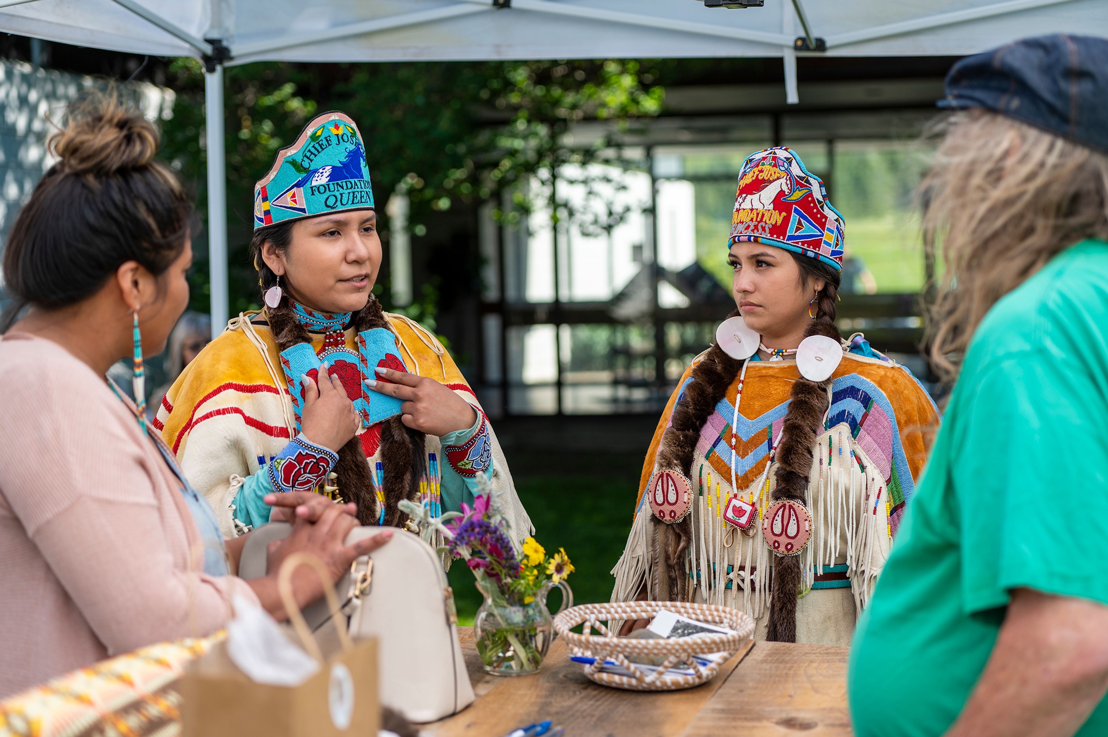 Lucy Samuels, from left, speaks with Chief Joseph Foundation queen Natasha SlimJohn and princess Abigail Whitman during Appy Festival on Thursday at the Appaloosa Museum and Heritage Center in Moscow.