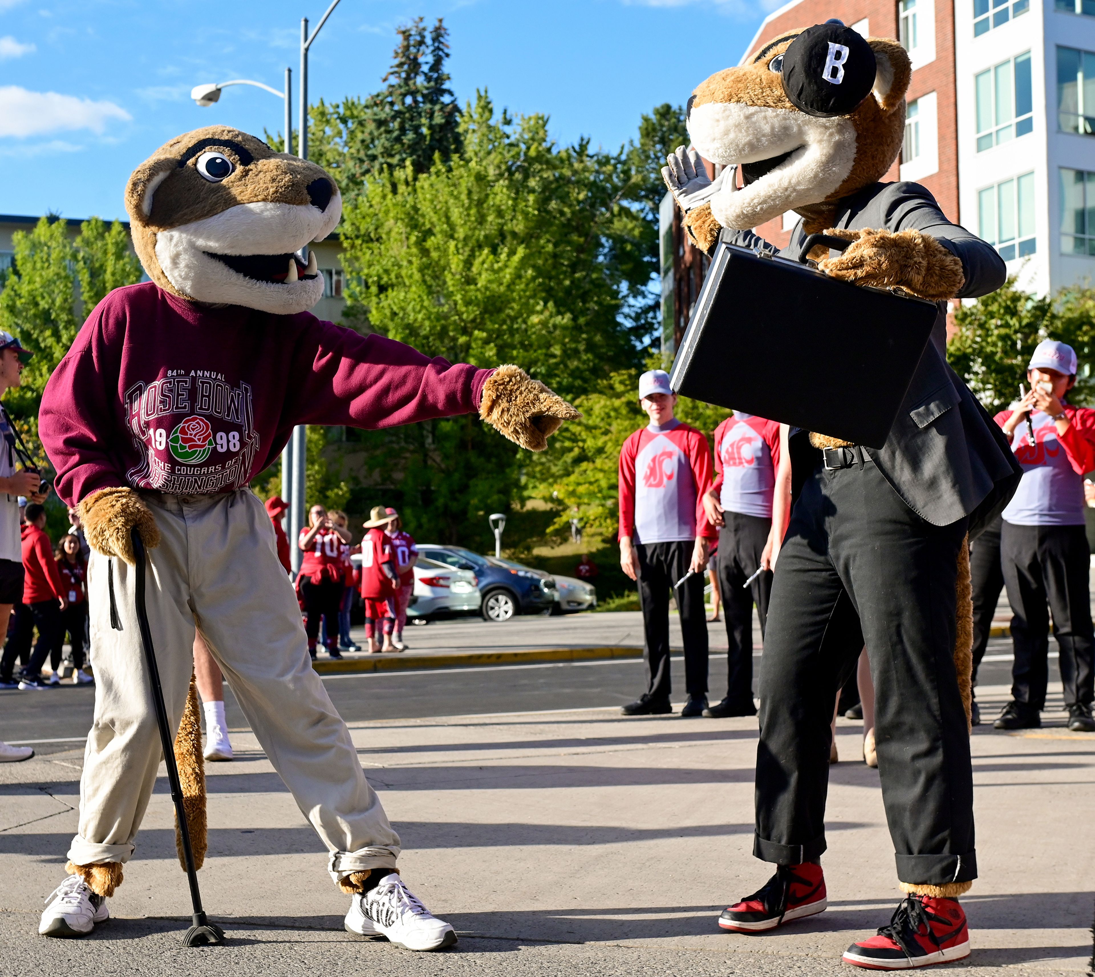 Paw Paw, left, and Butch T. Cougar prepare for Family Weekend game day Friday in Pullman.