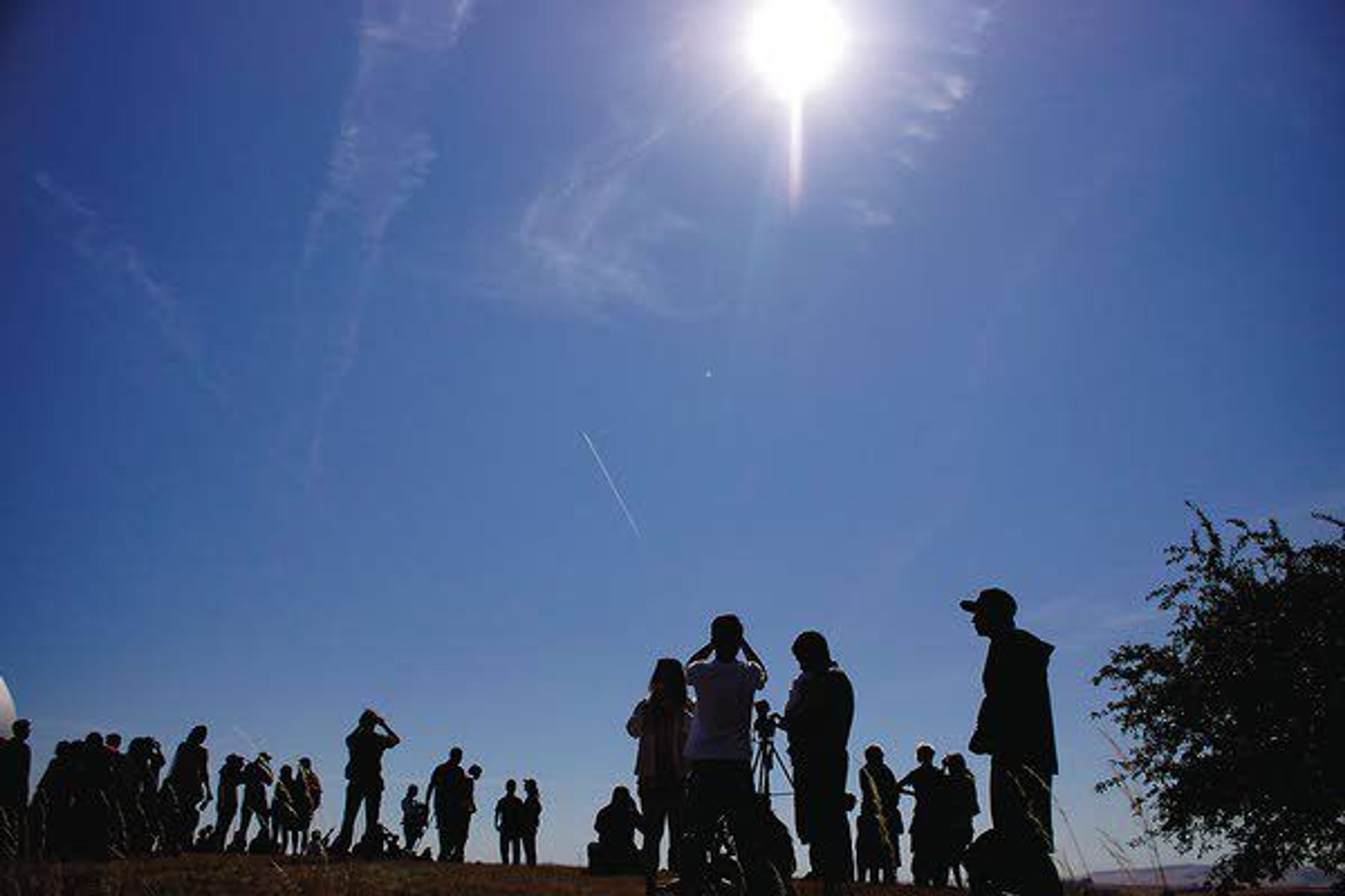 A crowd gathers near WSU's Jewett Observatory to watch Monday's solar eclipse.