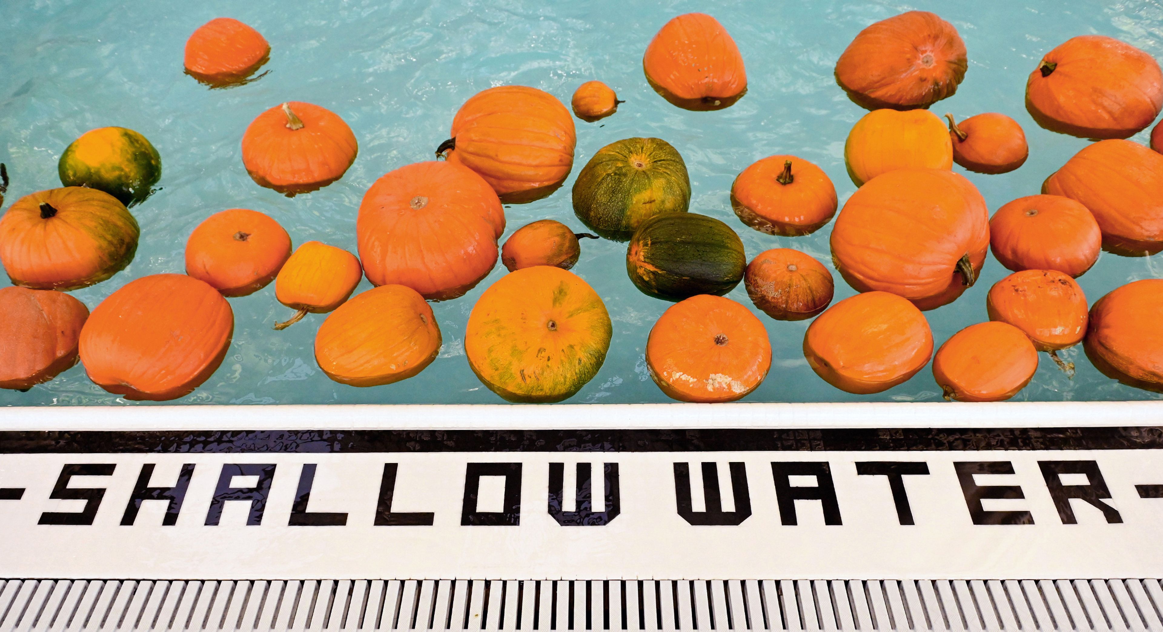 Pumpkins float in the pool of the Washington State University Student Recreation Center pool Wednesday in Pullman.,