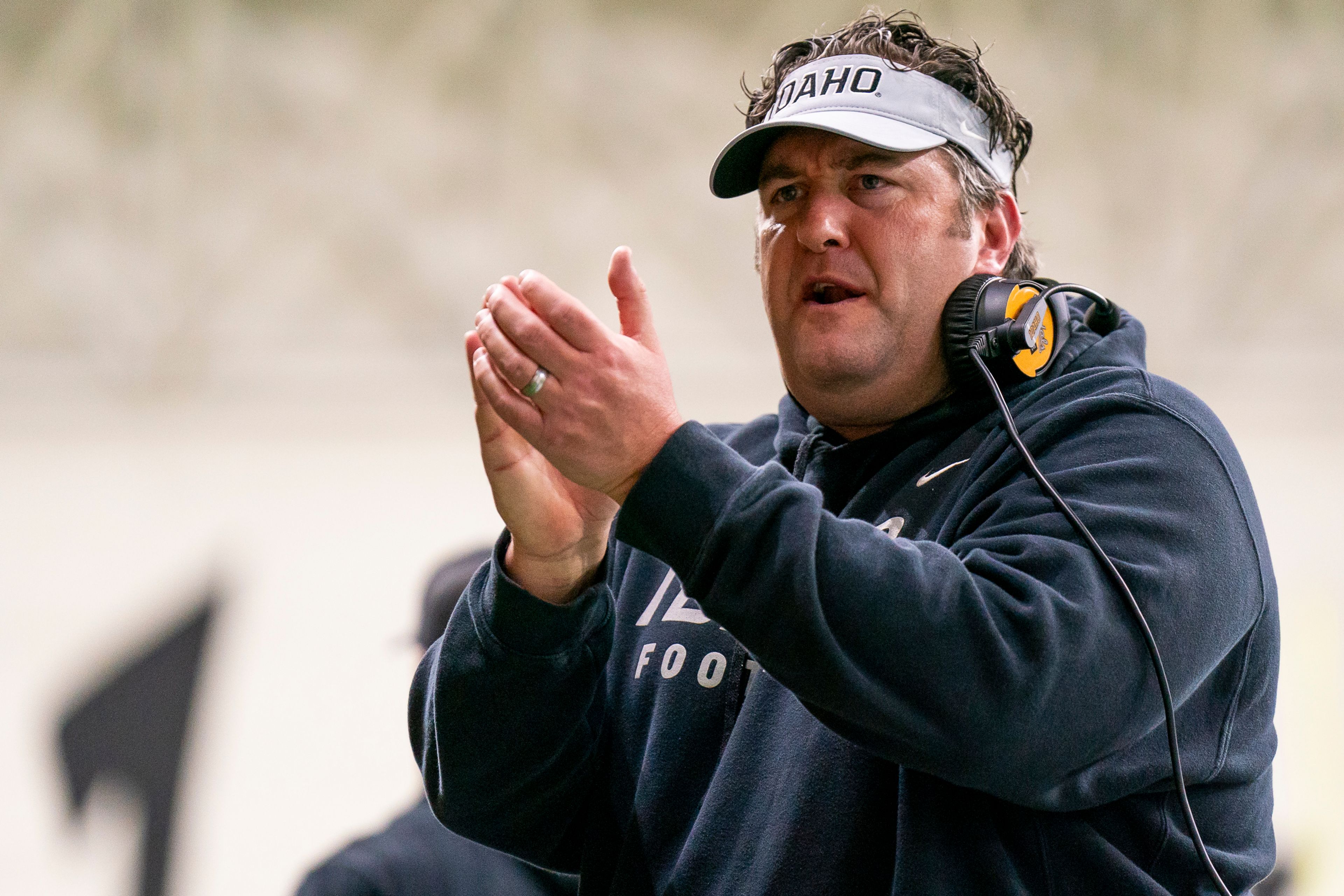 Idaho Vandals coach Jason Eck motivates his team during a game against Southern Illinois in the second round of the 2023 FCS playoffs on Dec. 2 at the Kibbie Dome in Moscow.