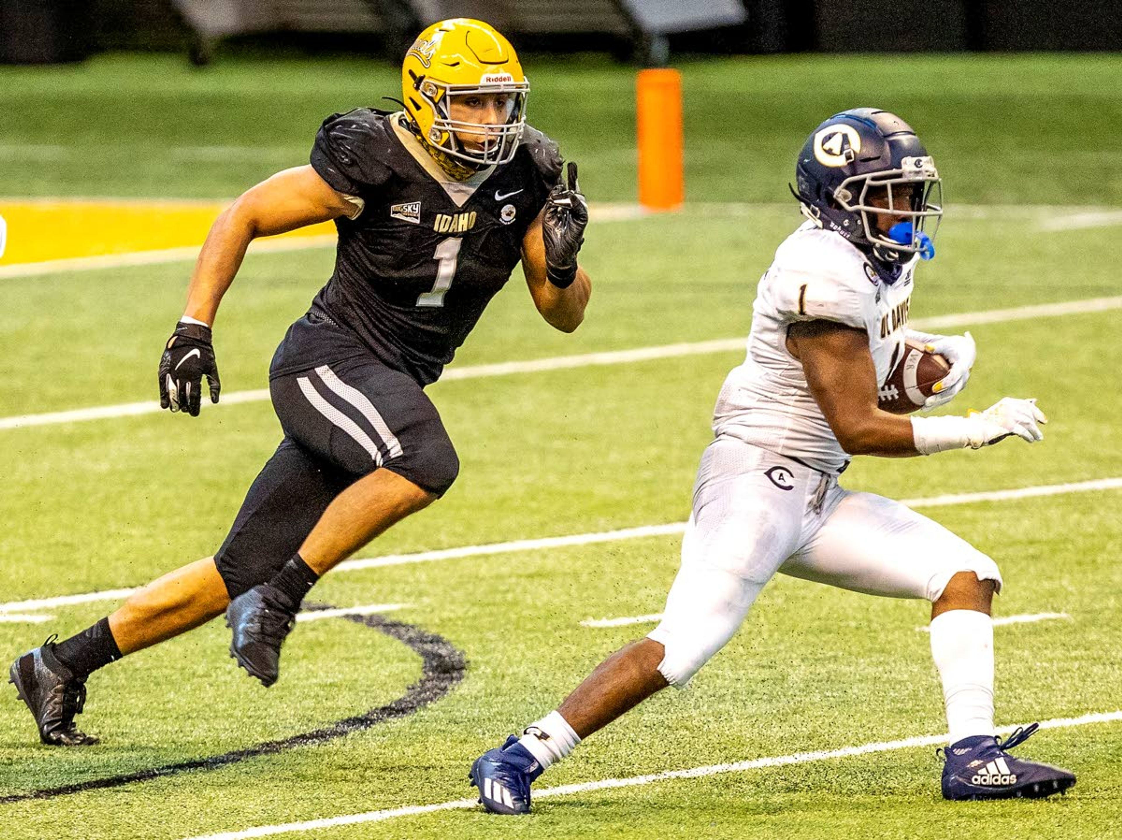 August Frank/Daily NewsIdaho Vandals linebacker Christian Elliss tracks down UC Davis wide receiver C.J. Hutton in a football game March 6.